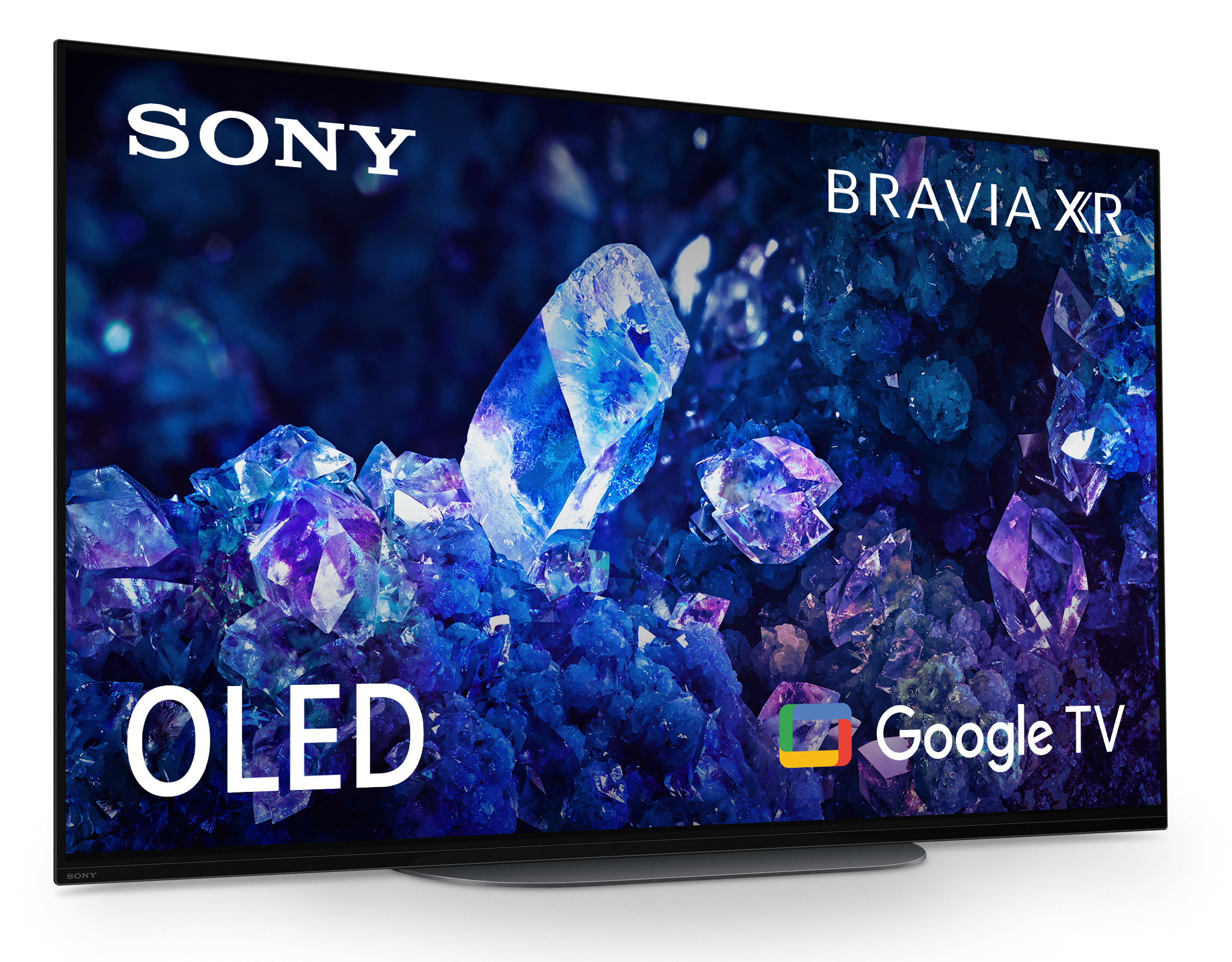 Duży telewizor Sony z ciemnoniebieskim i fioletowym abstrakcyjnym obrazem na ekranie. Widoczne logo Google TV.