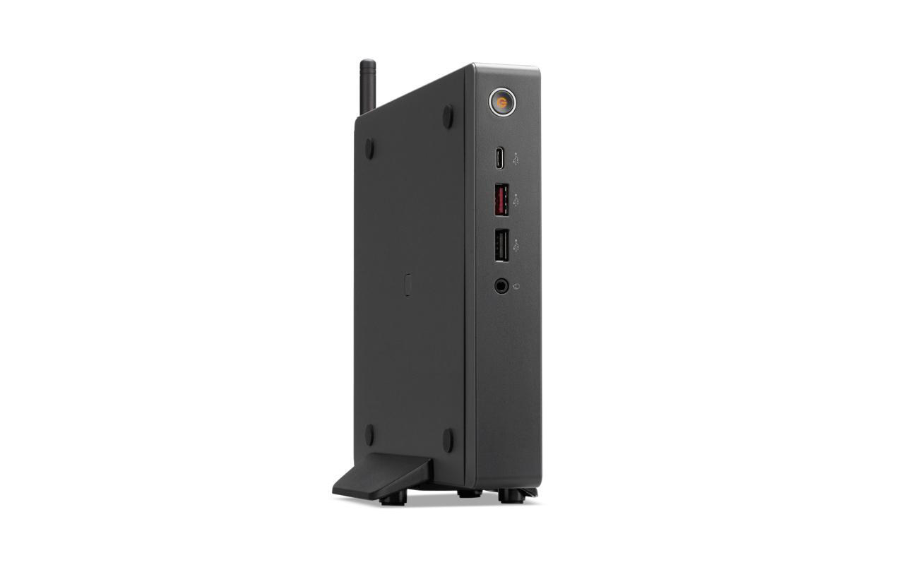 Seitenansicht eines schwarzen, kleinen Computers mit Anschlüssen, aufrecht stehend, weißer Hintergrund.