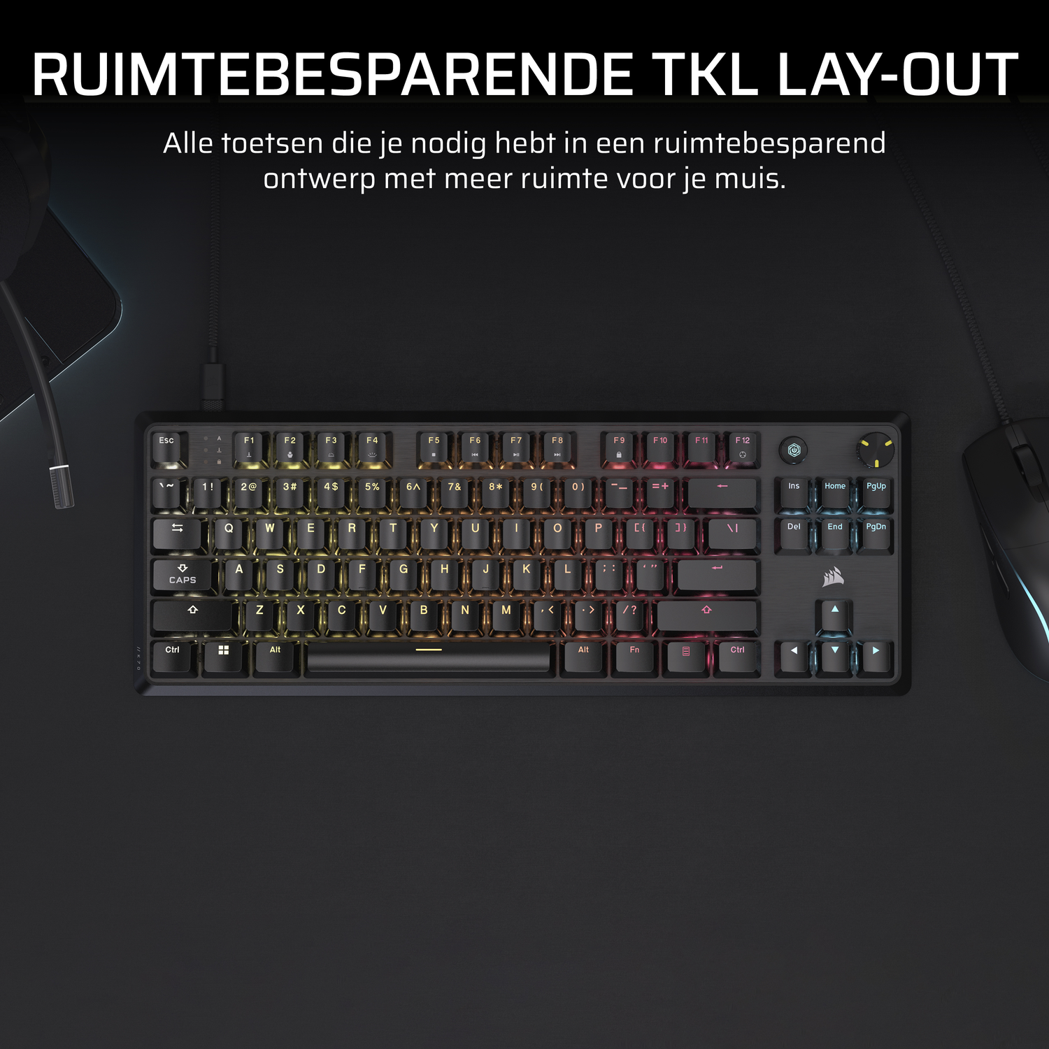 A black keyboard with rainbow keys, mouse, and a black surface. Text says TKL LAY-OUT.