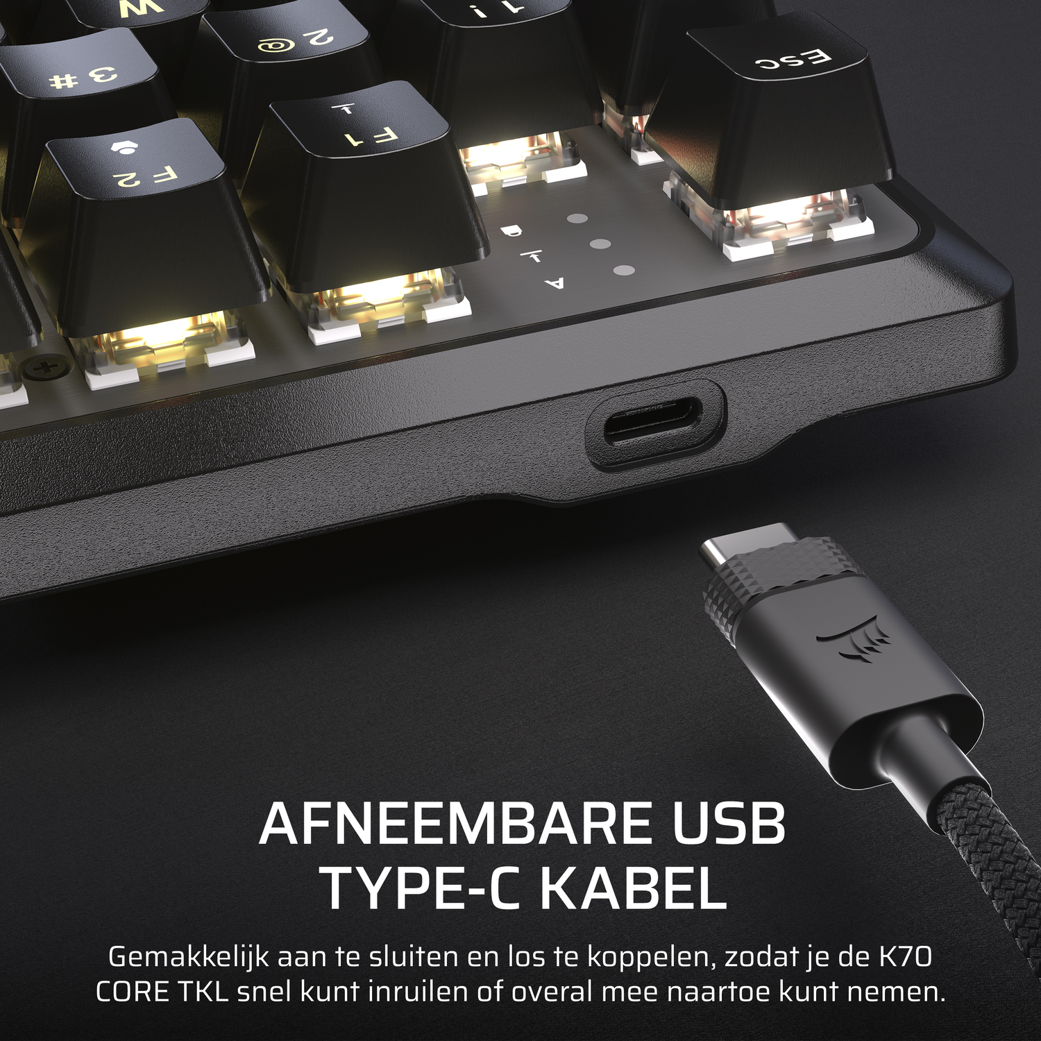 A close-up of a keyboard with USB-C cable attached, with text below in Dutch.
