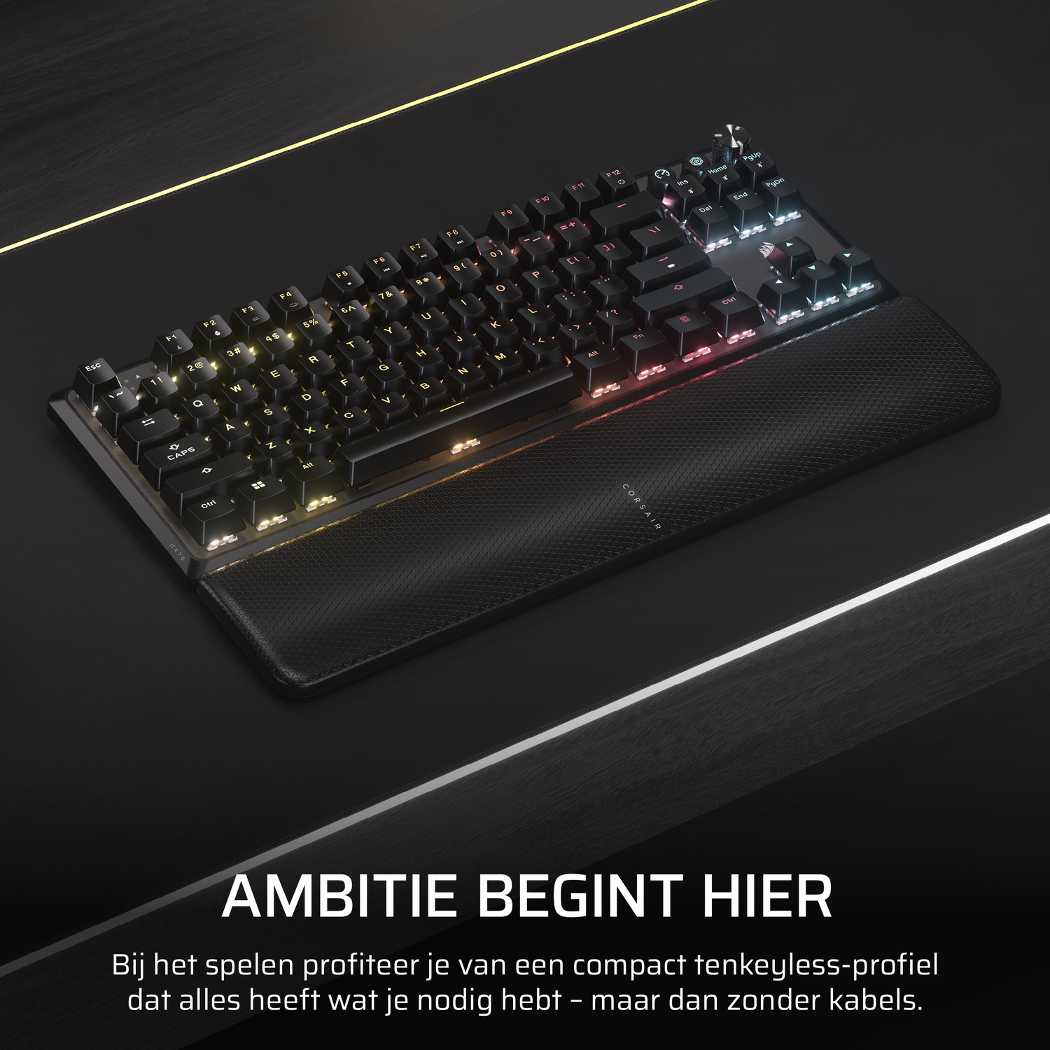 Black keyboard with colorful LED lights, and a wrist rest. Text: Ambition starts here.