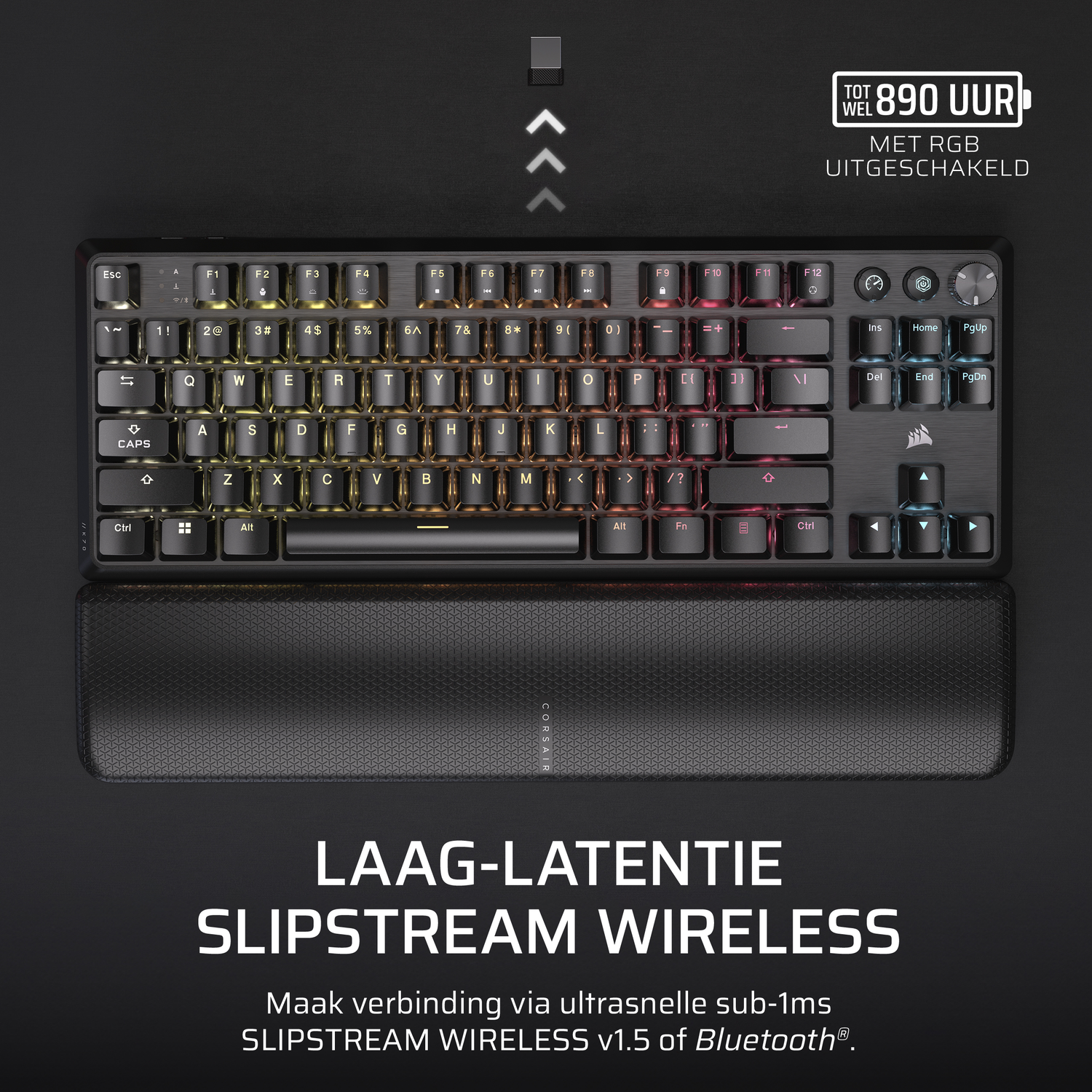 Black Corsair keyboard with RGB lighting, a wrist rest, and text on a white background.