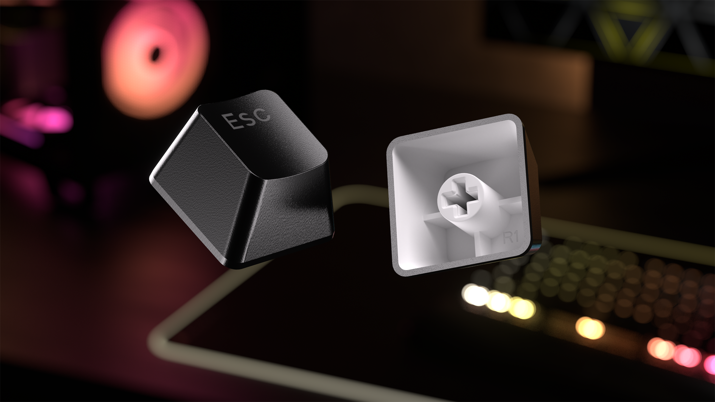 Deux touches de clavier, la touche Esc et le dessous de la touche. Touches noires sur fond sombre.
