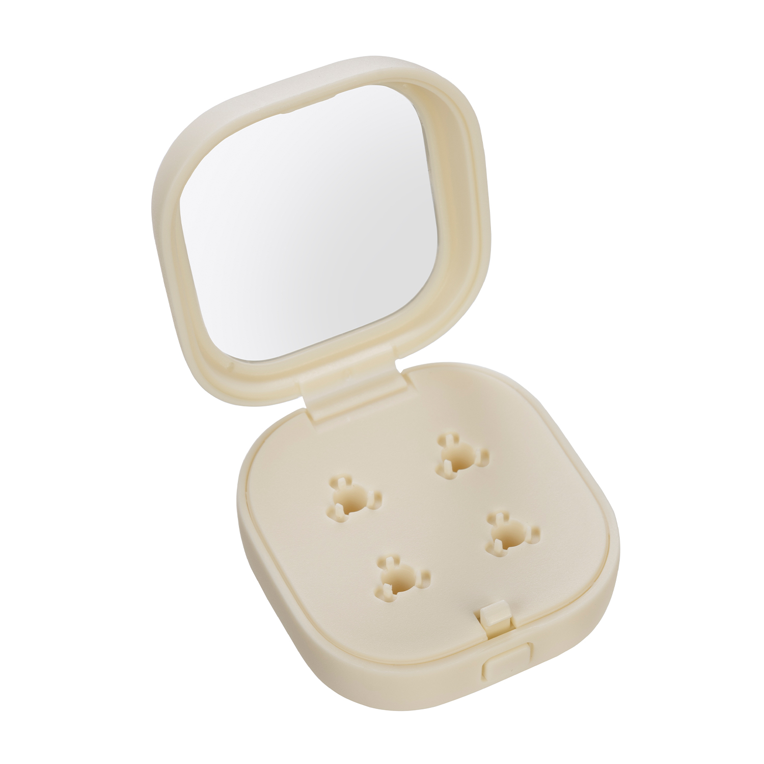 Custodia compatta color crema aperta con specchio e quattro piccole rientranze.