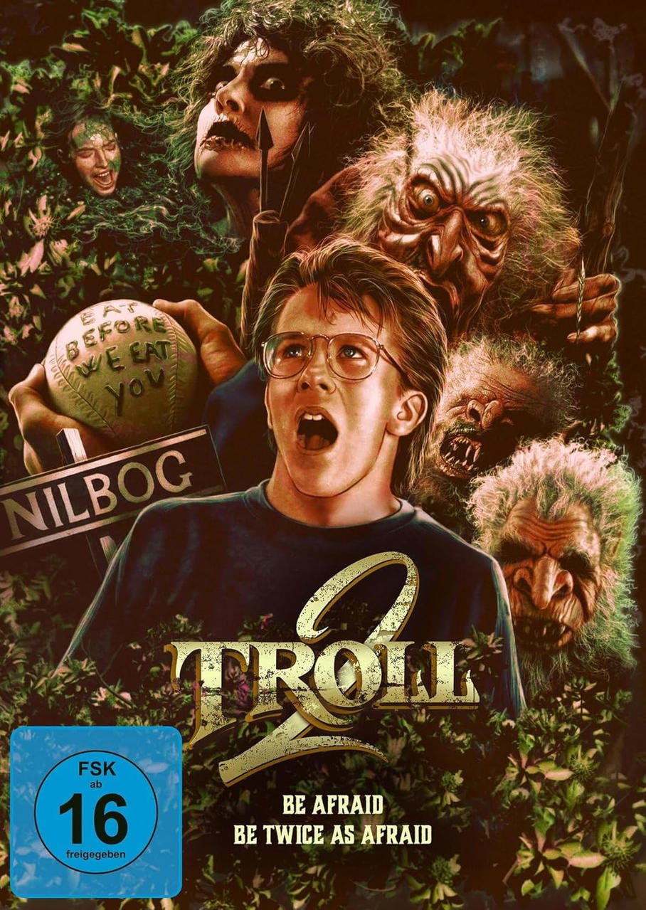 DVD-Cover: Troll 2. Junge mit Brille, gruselige Gesichter und Monster. Grünes Laub.