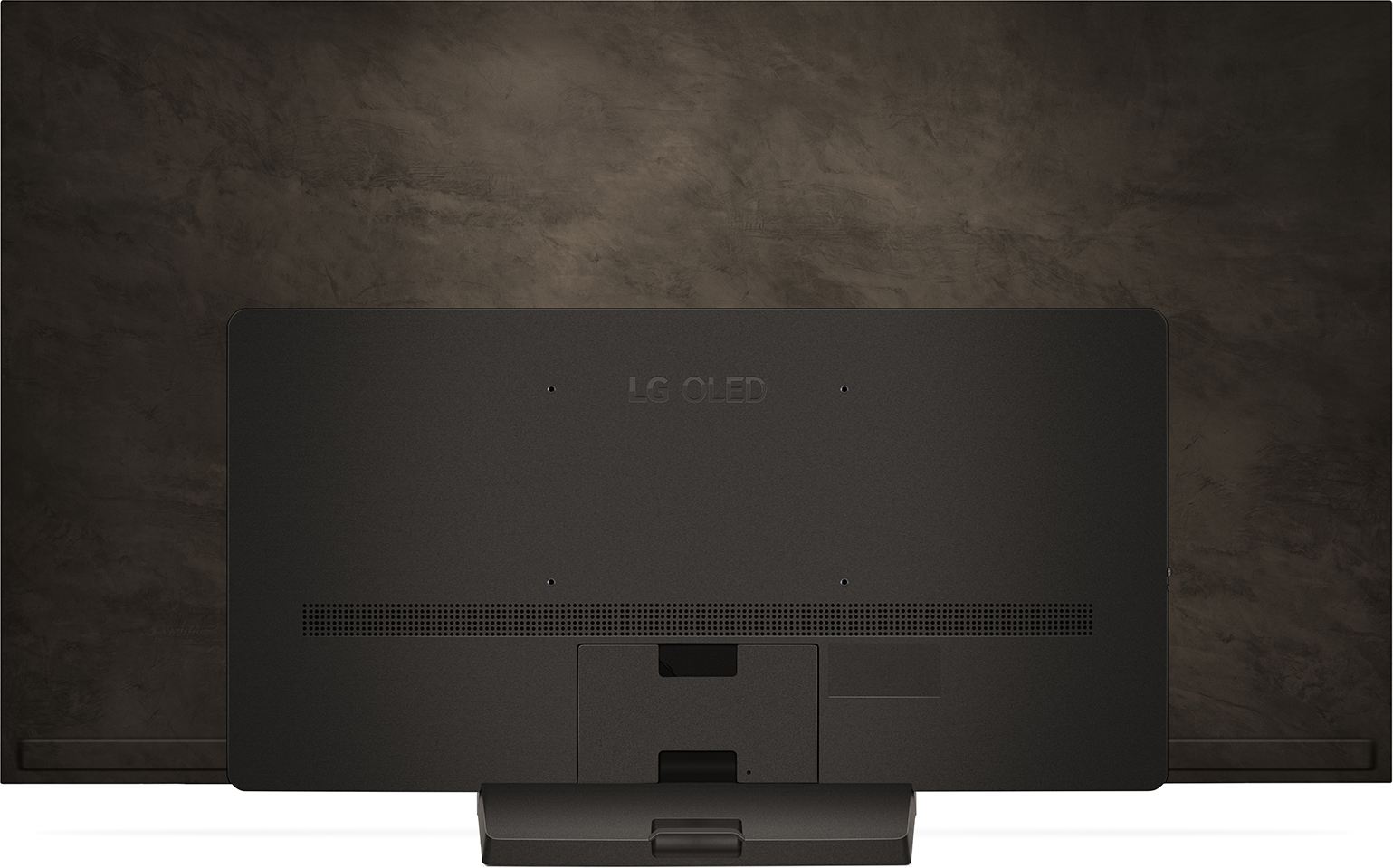 Rückseite eines großen LG OLED-Fernsehers, Anschlüsse und Ständer sichtbar.