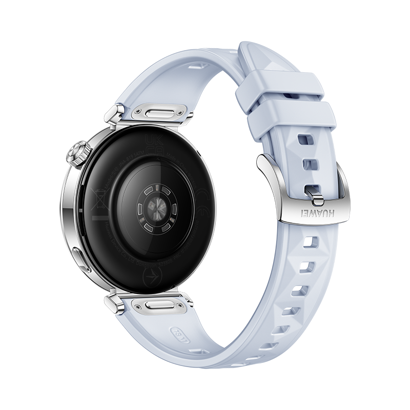 Vista trasera de un smartwatch con correa blanca. Muestra el sensor de frecuencia cardíaca.