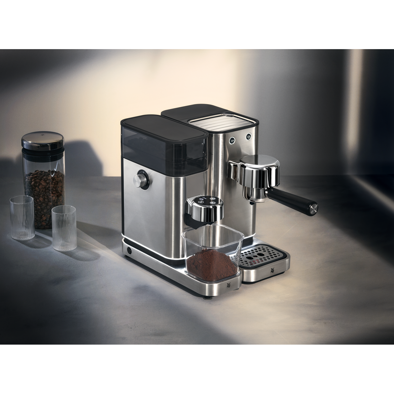 A close-up of a coffee machine with a portafilter and ground coffee.