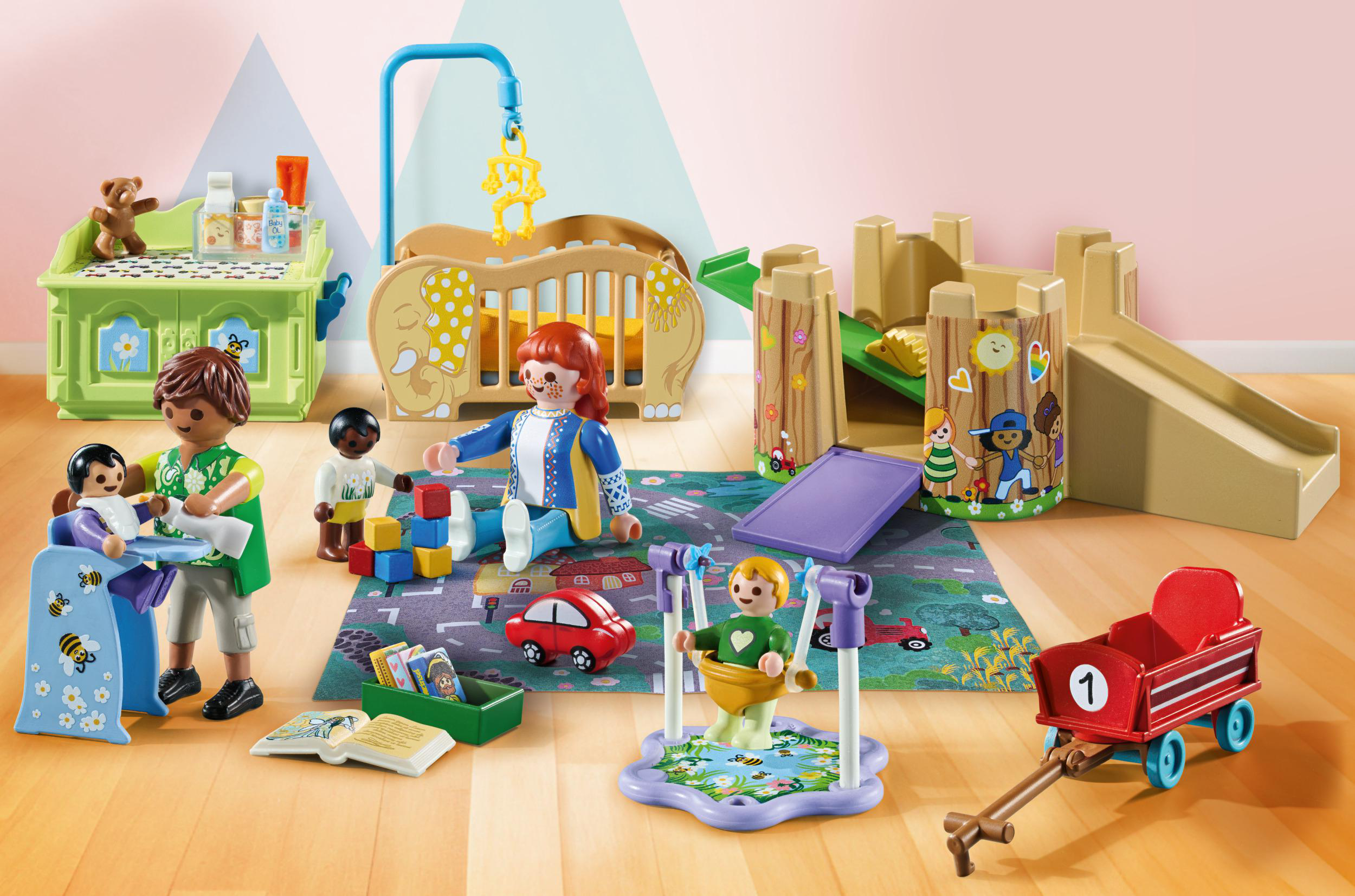 Playmobil-Spielzeugset mit Puppen, einer Krippe, Rutsche und Spielplatzgeräten.