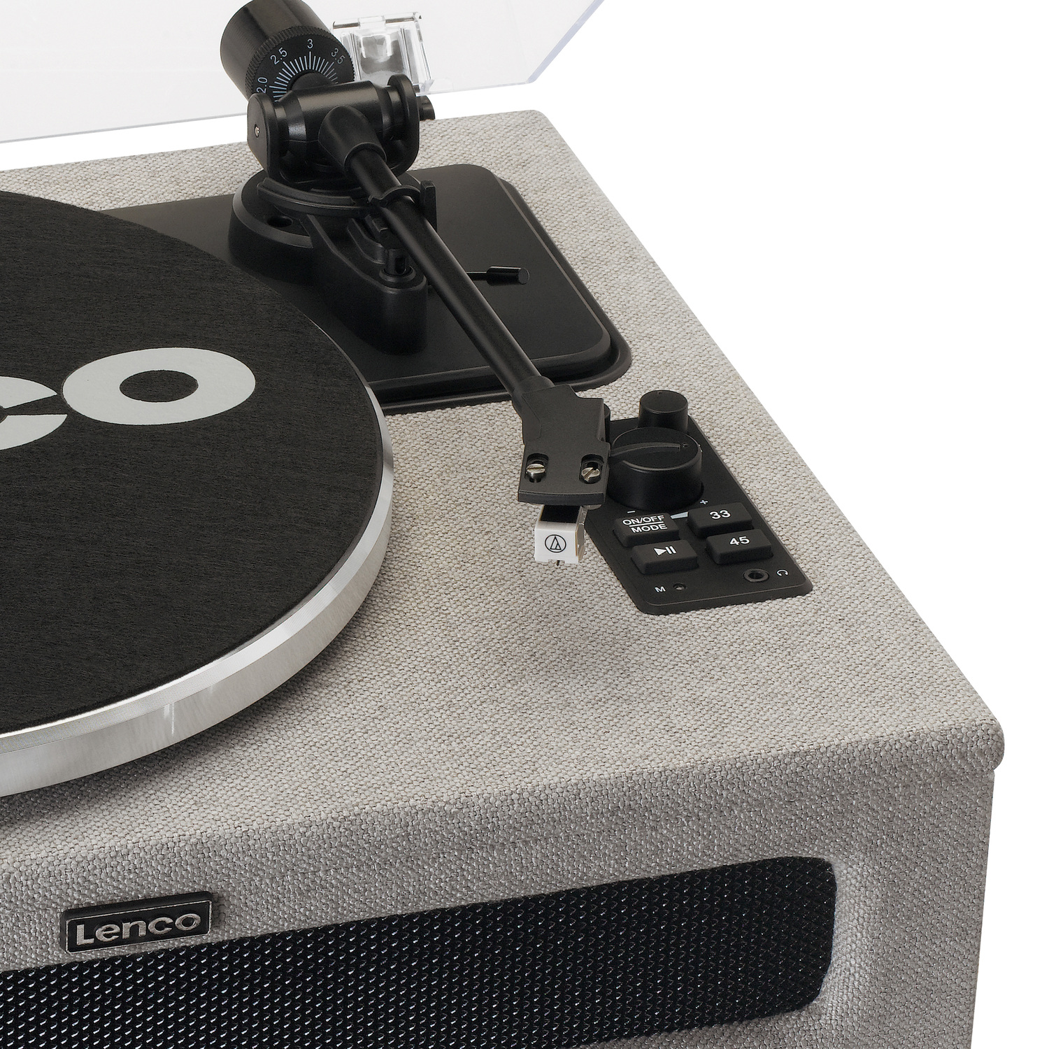 Turntable with a black record, silver body, and controls. Close-up of the turntable and its components.