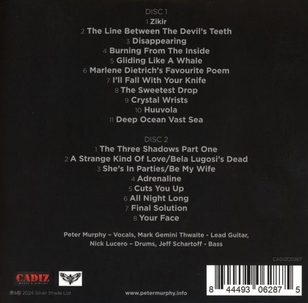 CD-Cover mit Titelliste, darunter 'The Line Between the Devil's Teeth' und 'Your Face' von Peter Murphy.