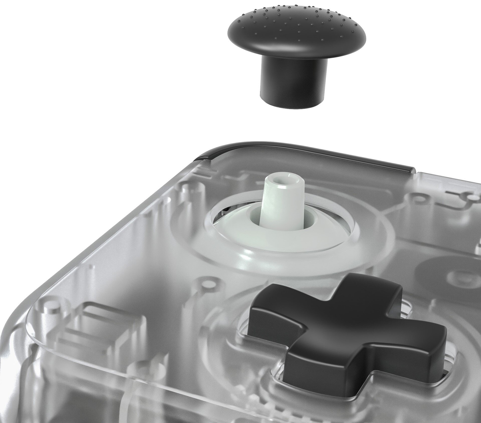 Zbliżenie kontrolera do gier. Nakładka na joystick jest czarna i odłączona.