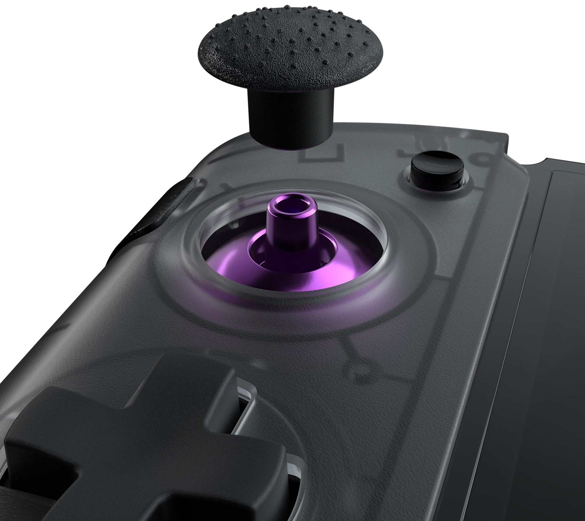 Zbliżenie kontrolera do gier z joystickiem i fioletowym mechanizmem wewnętrznym.