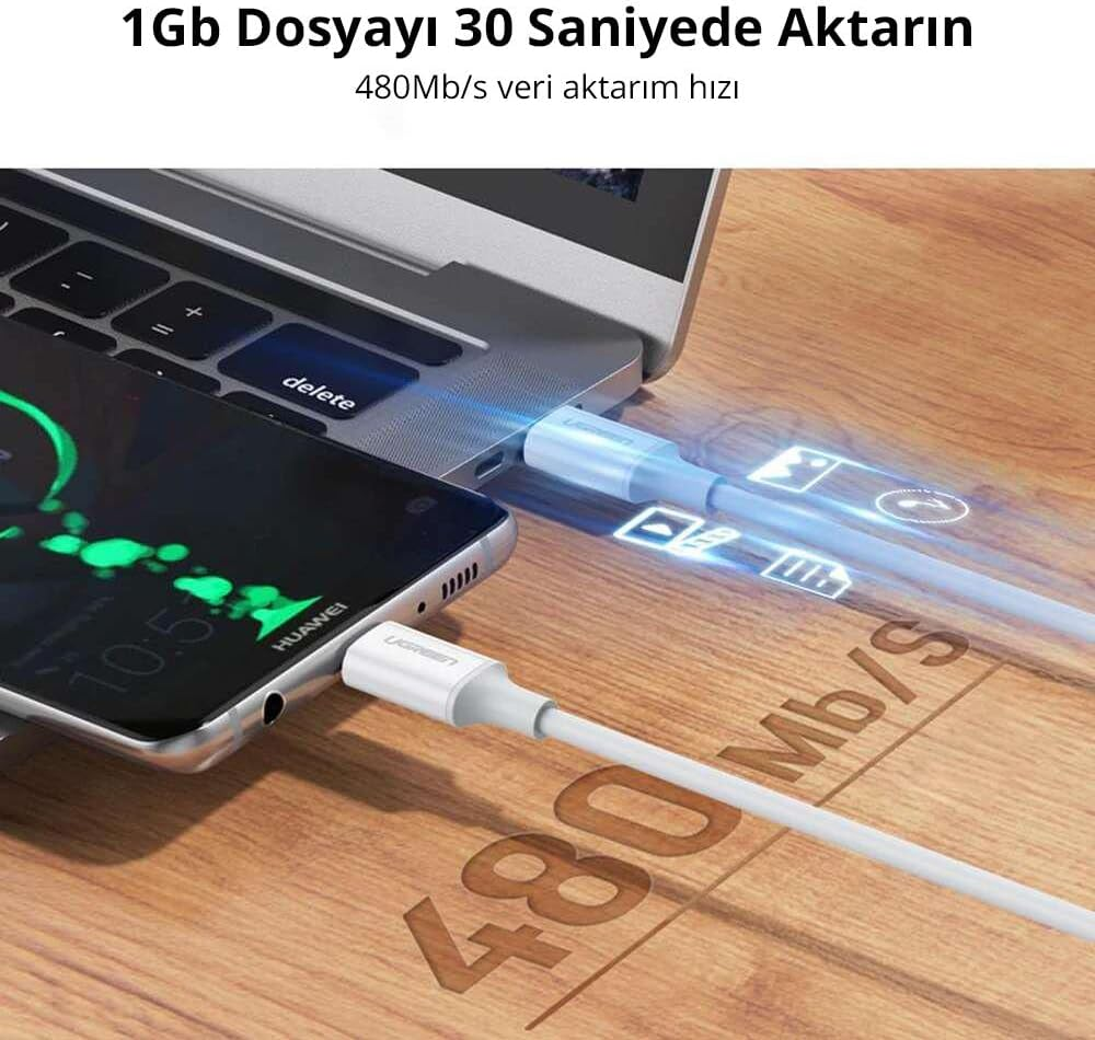 Beyaz bir kabloyla bir dizüstü bilgisayara bağlı bir telefon, veri aktarım hızını gösteriyor.