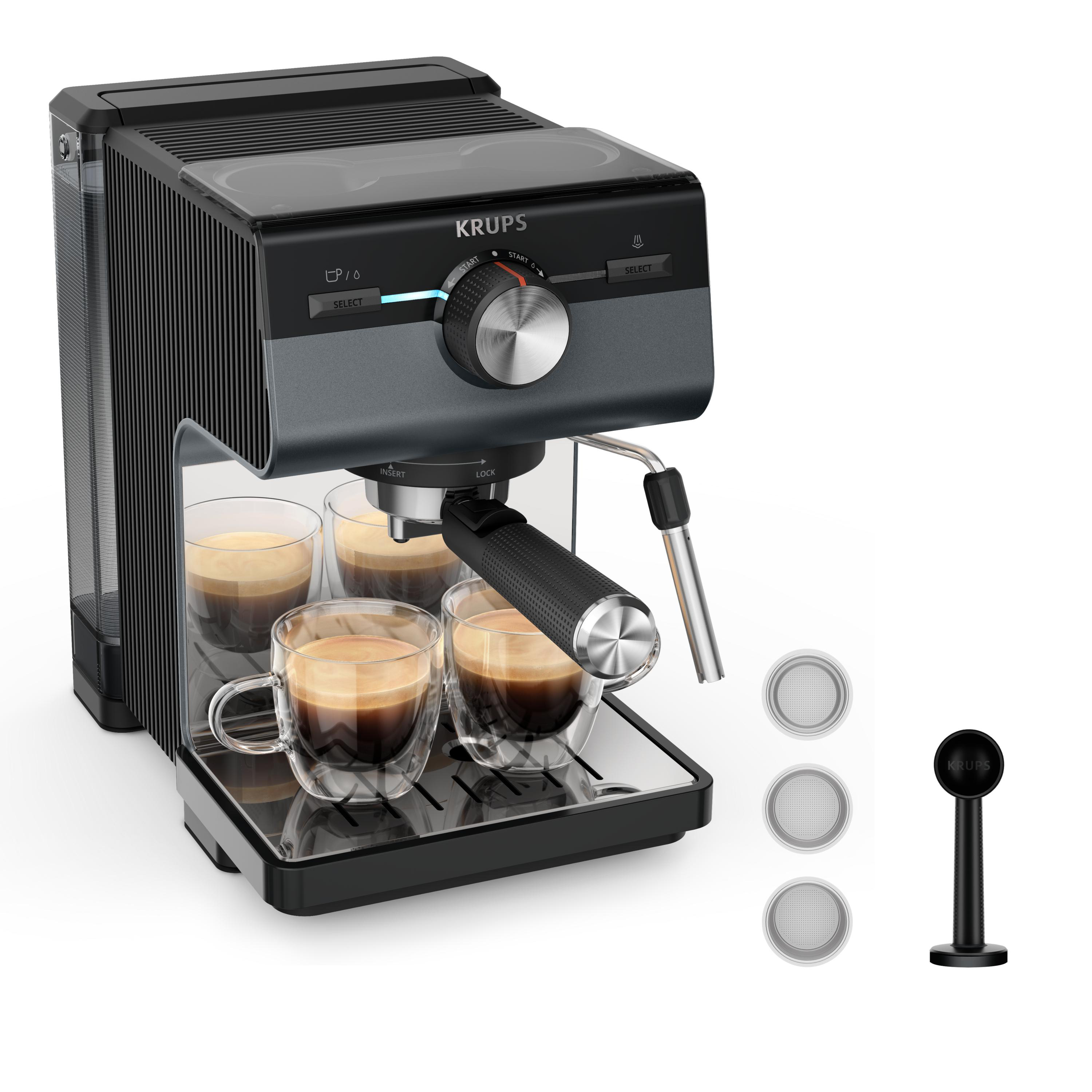 Schwarze und graue Espressomaschine mit vier Kaffeetassen. Zubehör ist rechts.