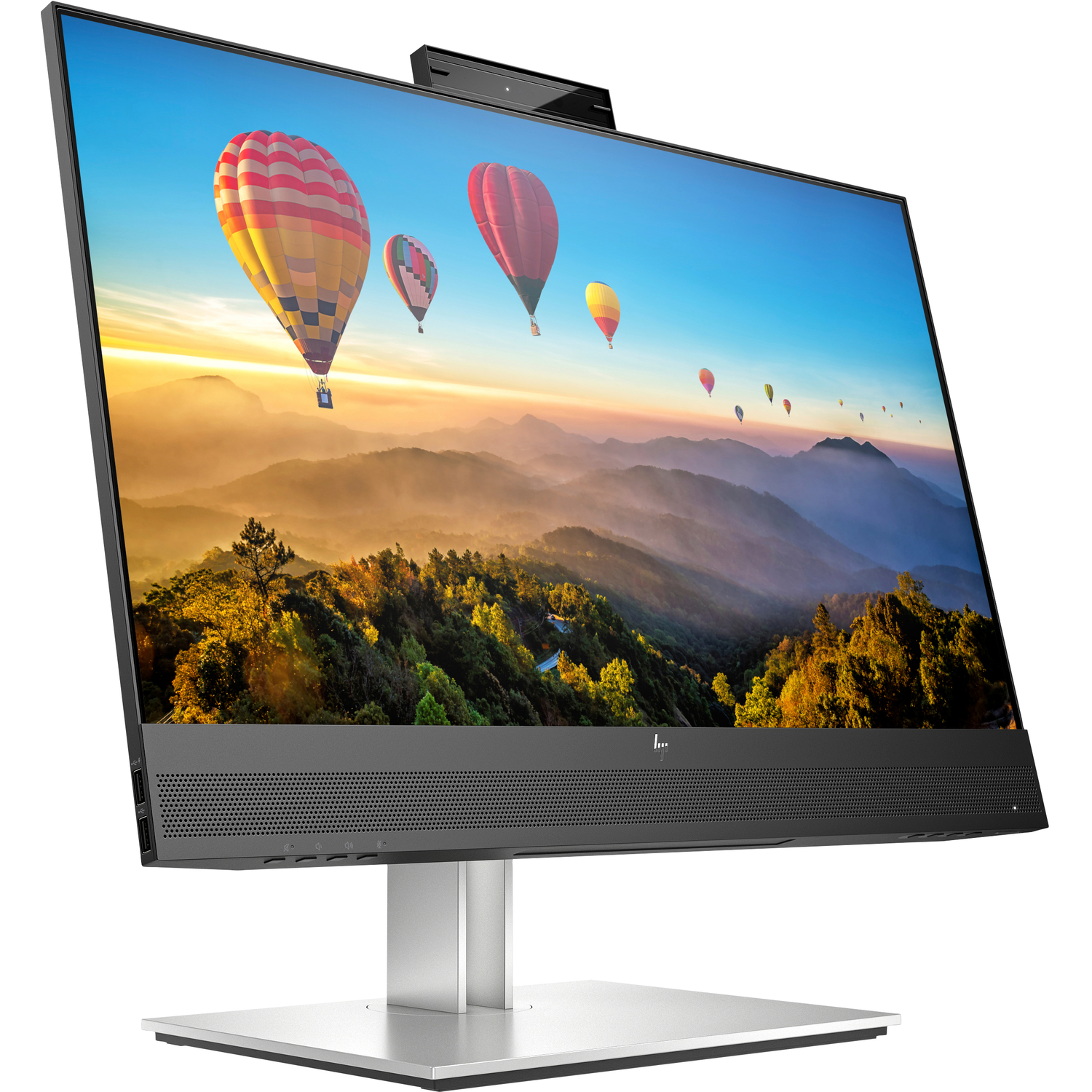An HP all-in-one desktop computer with a large screen displaying hot air balloons floating over a mountain range.