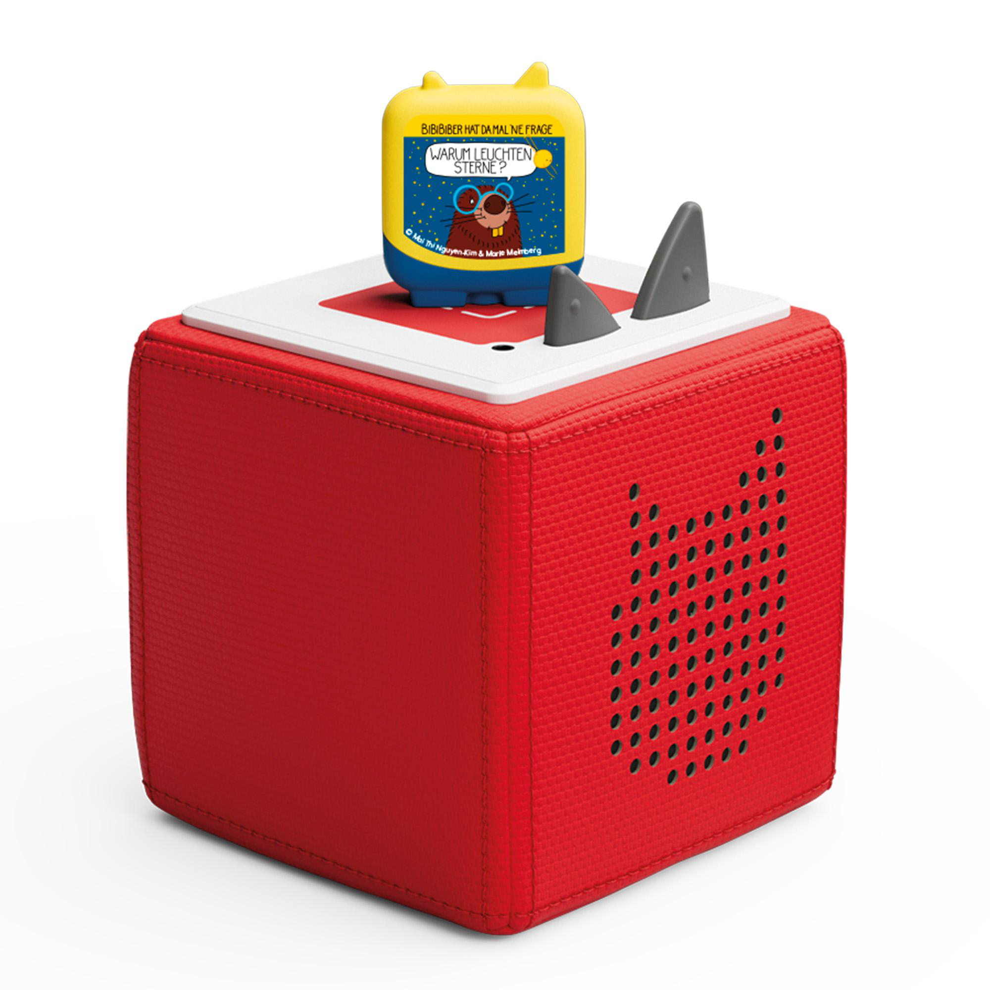 Eine rote Toniebox mit einer Tonie-Figur oben drauf.