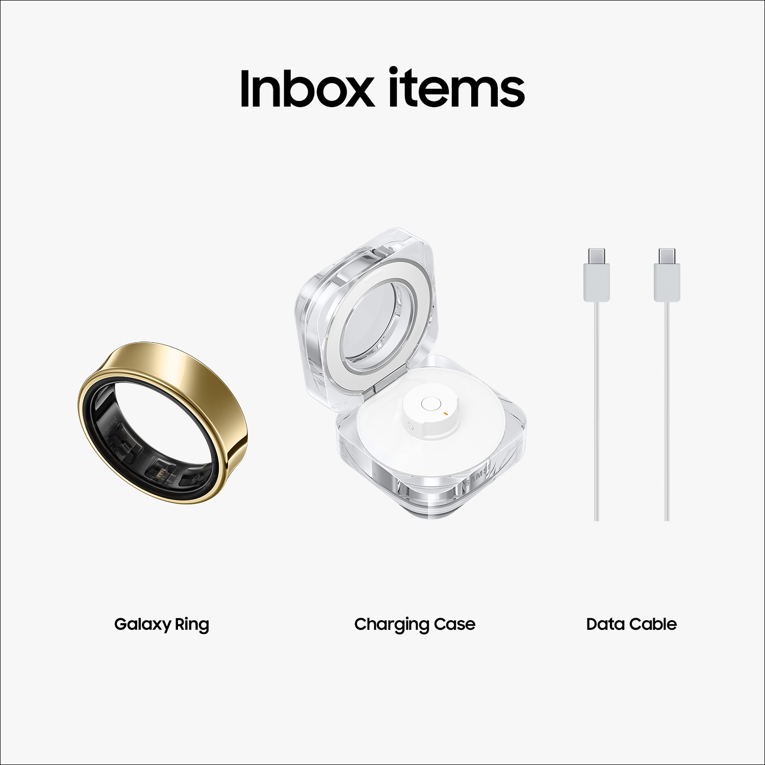 Inbox items: een gouden ring, een oplaadcase en twee witte oplaadkabels. Allemaal op een grijs oppervlak.