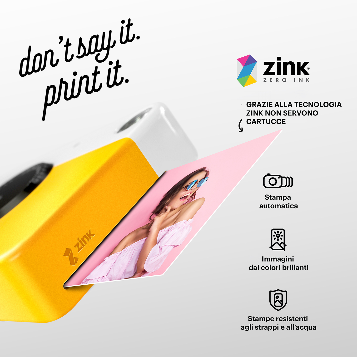 Stampante gialla con foto di una donna. Testo: 'don't say it. print it'.