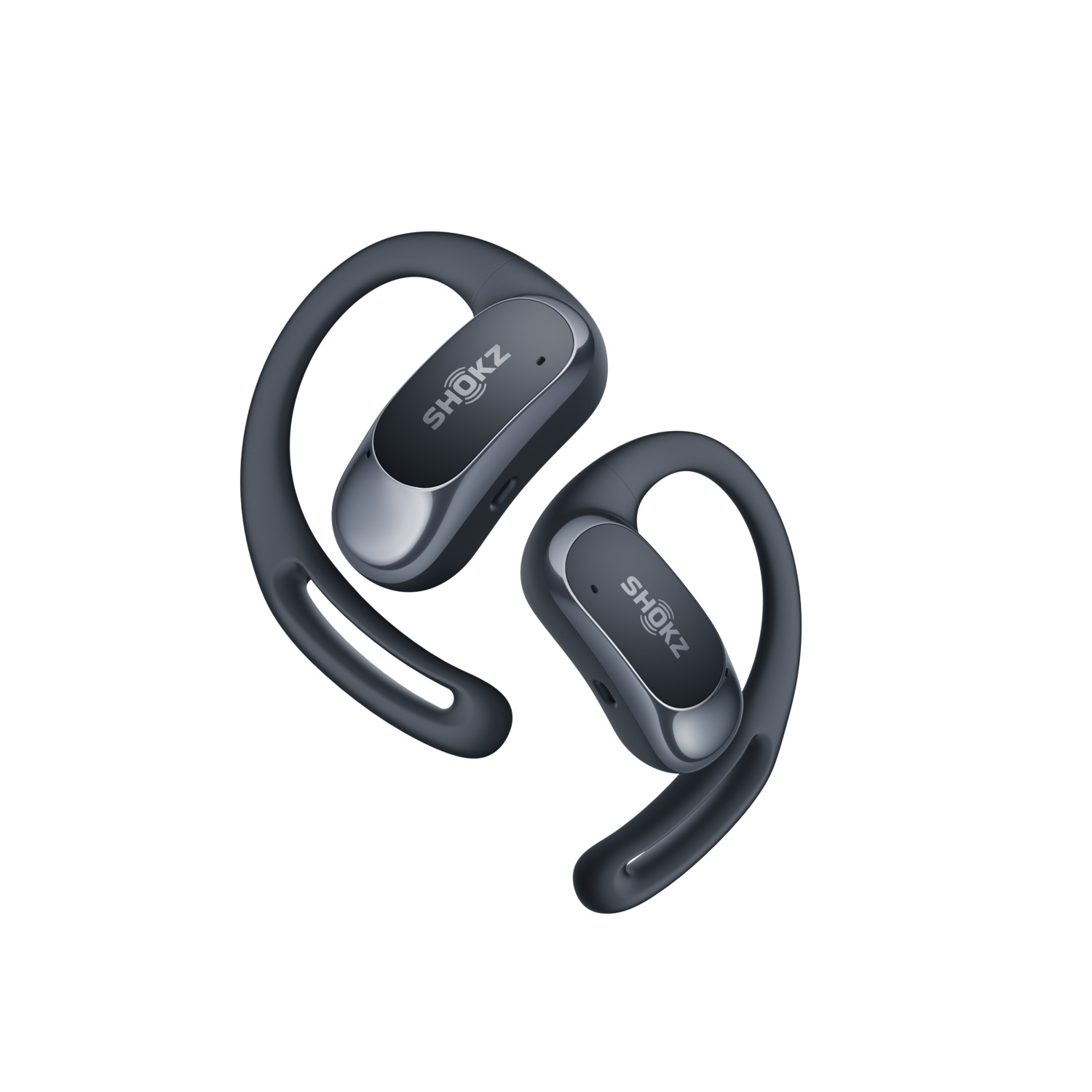 Une paire d'écouteurs Shokz gris, conçus pour s'accrocher aux oreilles, est présentée dans une prise de vue en studio sur fond blanc.
