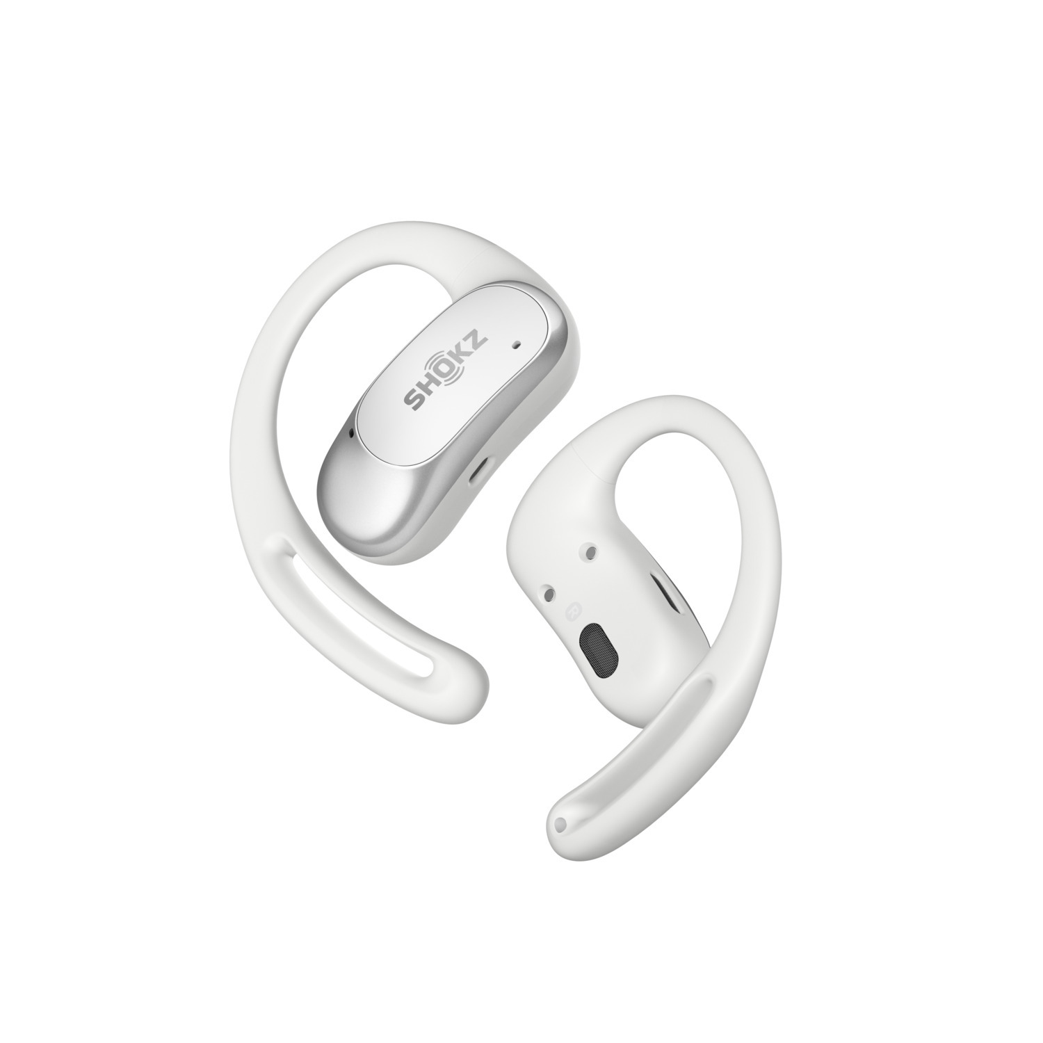 Écouteurs SHOKZ blancs sans fil, crochets d'oreille visibles. Le logo SHOKZ est argenté. Prise de vue en angle sur fond blanc.