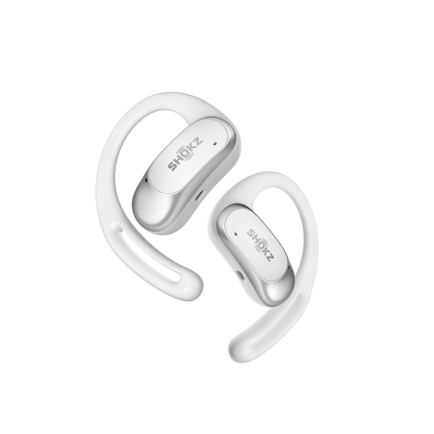 Écouteurs Shokz blancs et argentés, design à crochet d'oreille, sur fond blanc.