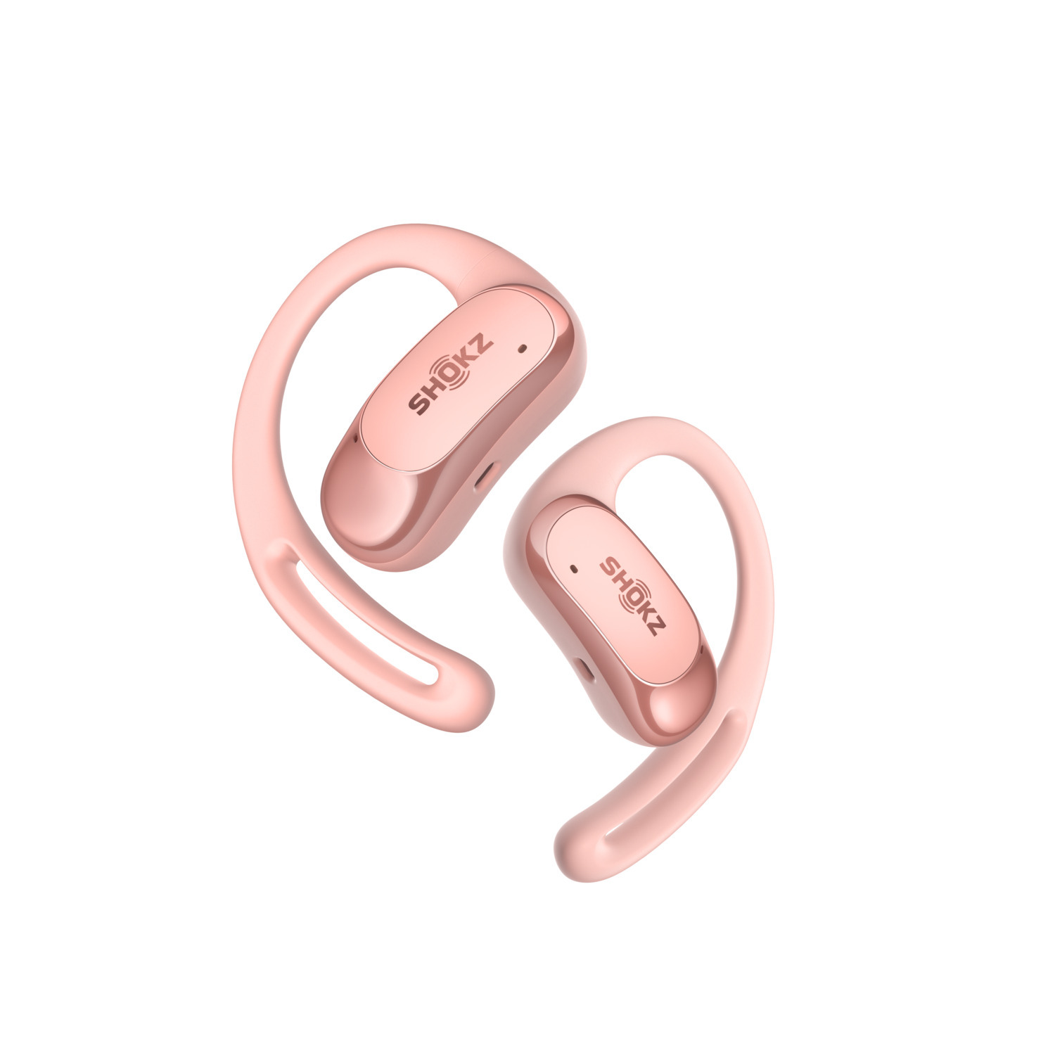 Écouteurs sans fil Shokz roses avec crochets d'oreille, vue en angle.