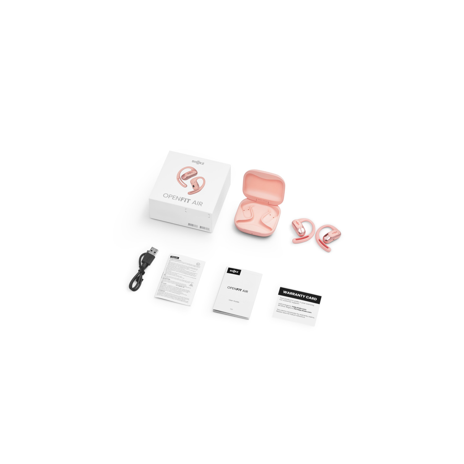 Écouteurs OpenFit Air avec la boîte, le câble de chargement et les documents.