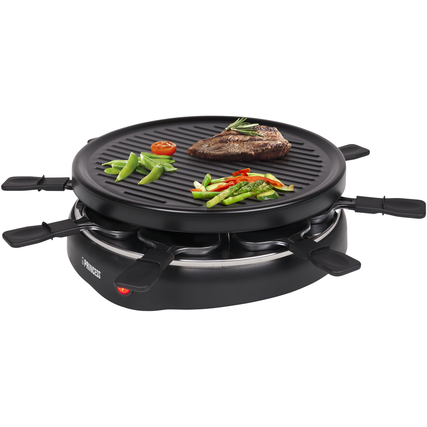 Raclette grill with food on it: steak, vegetables. Black surface.