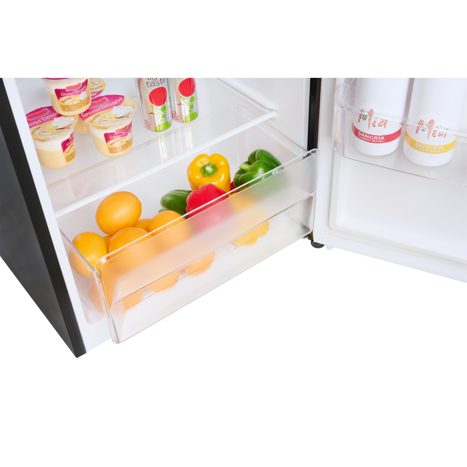 Refrigerator interior. Drawers with oranges and peppers, and bottles of juice.