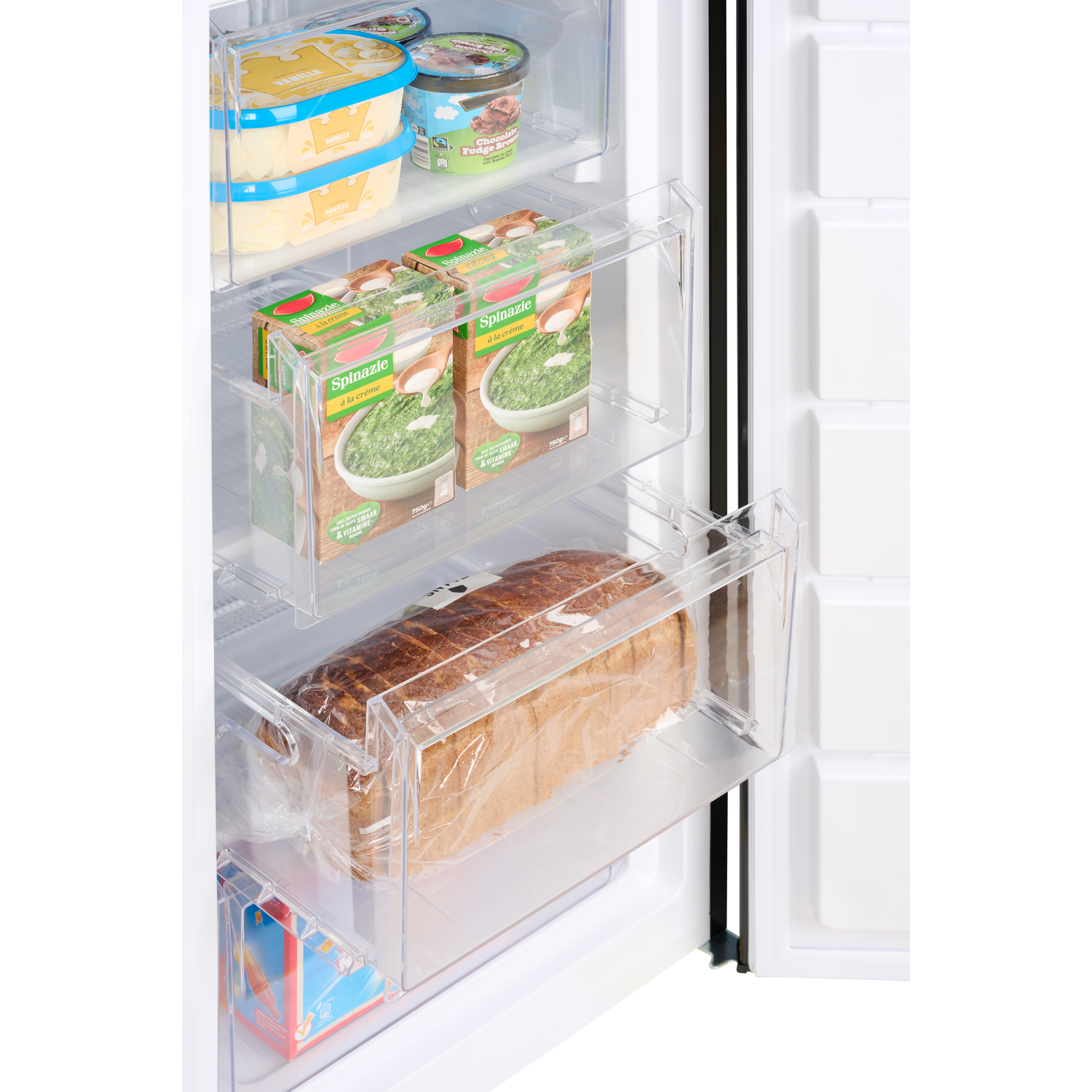 Freezer drawers with frozen spinach, bread, and other items inside.
