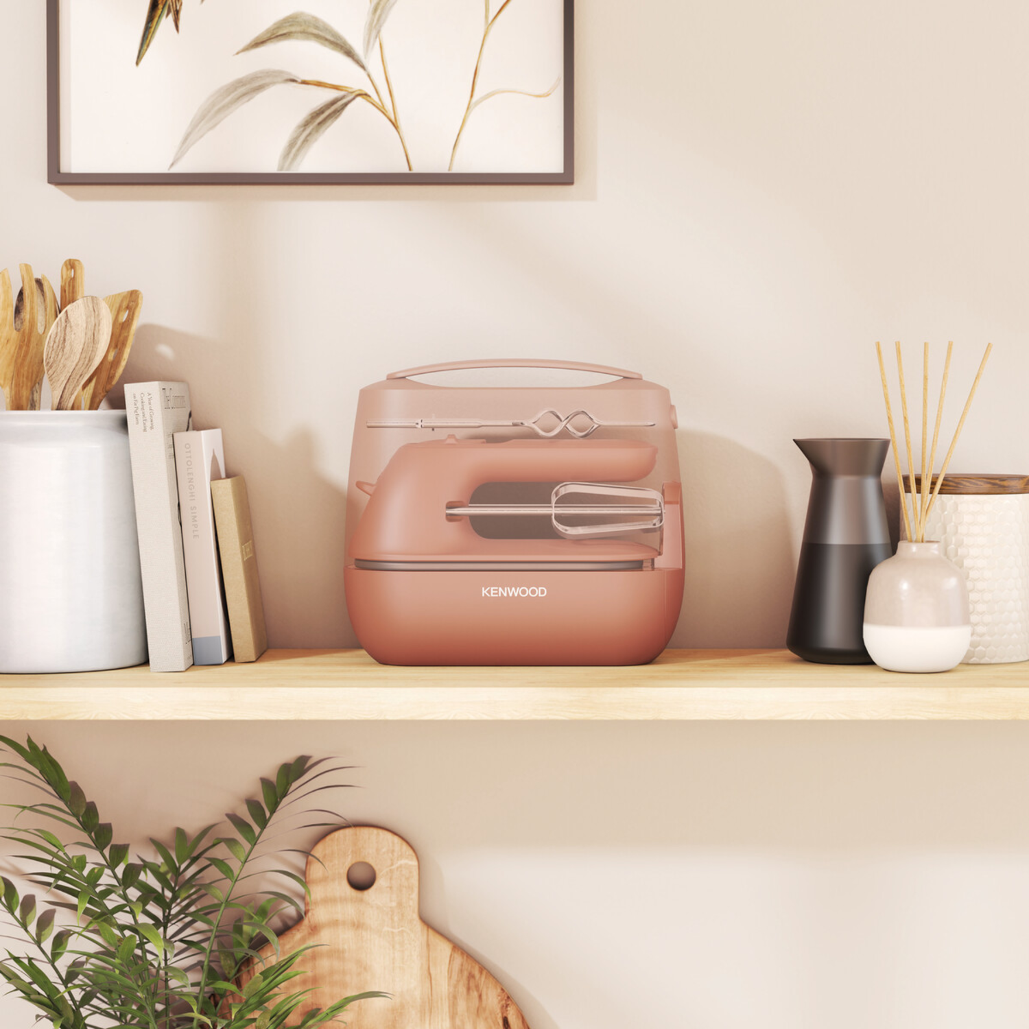 A kitchen shelf with a pink food mixer, wooden utensils, books, and decorative items.
