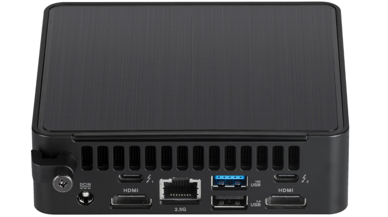 Schwarzer Mini-PC mit mehreren Anschlüssen: HDMI, USB und Ethernet. Oberseite hat eine strukturierte Oberfläche. Vorderseite hat einen DCIN-Anschluss.
