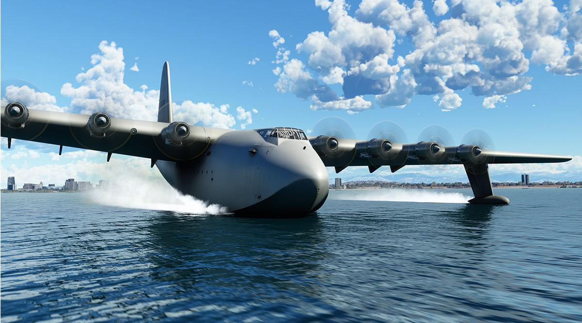 Ein großes Wasserflugzeug auf dem Wasser mit blauem Himmel, Wolken und einer Stadt im Hintergrund.