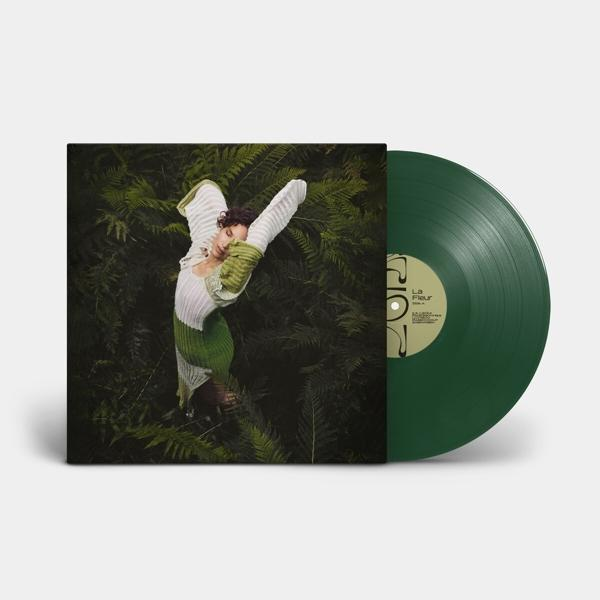 Groene vinylplaat op een witte achtergrond, met albumhoes met een vrouw in het groen.