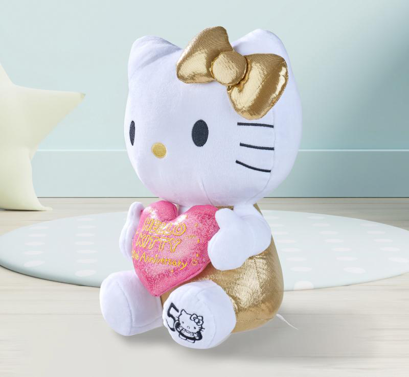 Hello Kitty Plüschtier, das ein rosa Herz hält. Goldene Schleife und Akzente. Weißes Fell.
