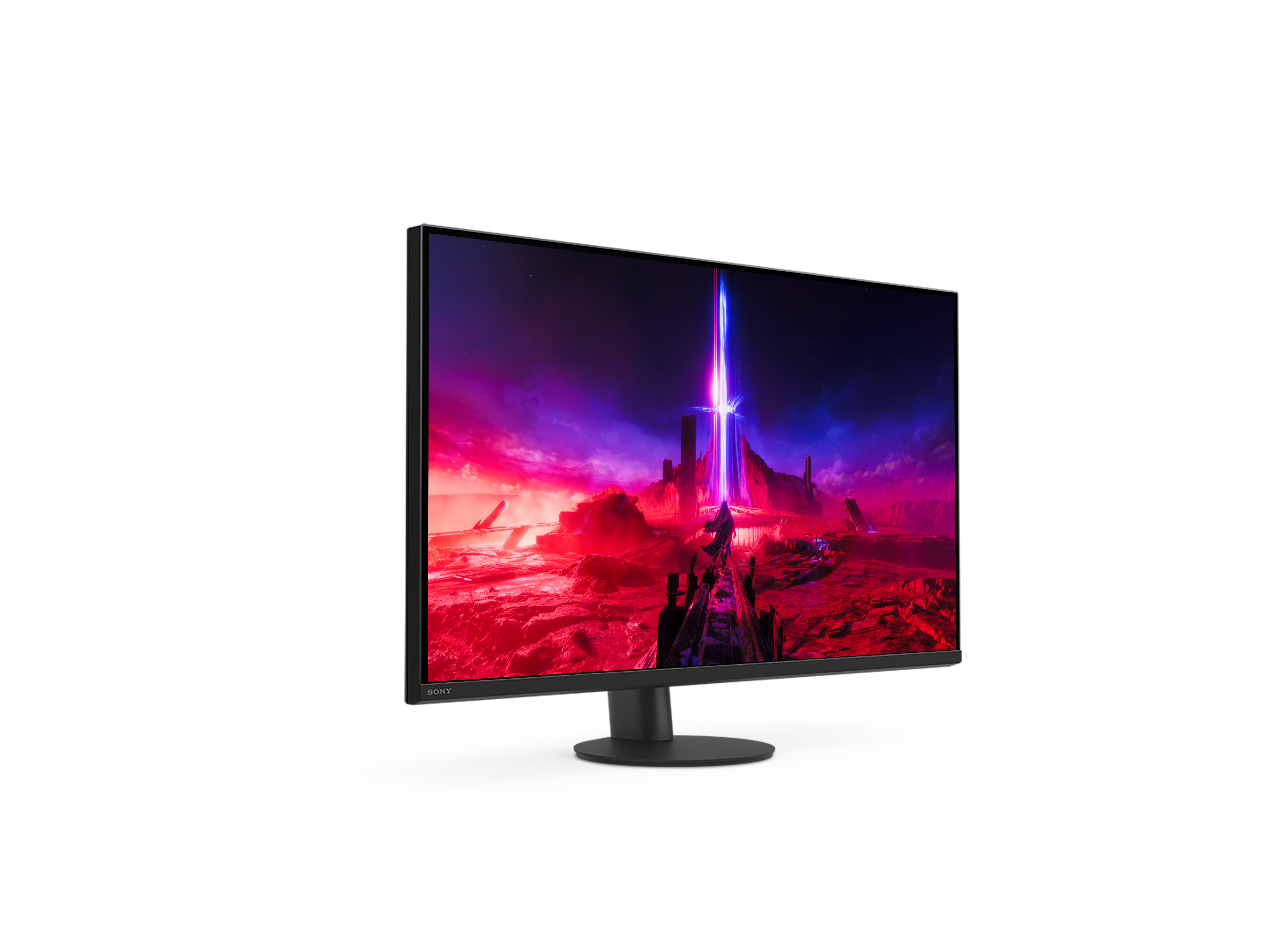 Ein schwarzer Computermonitor mit einer Landschaftsszene im Hintergrund.