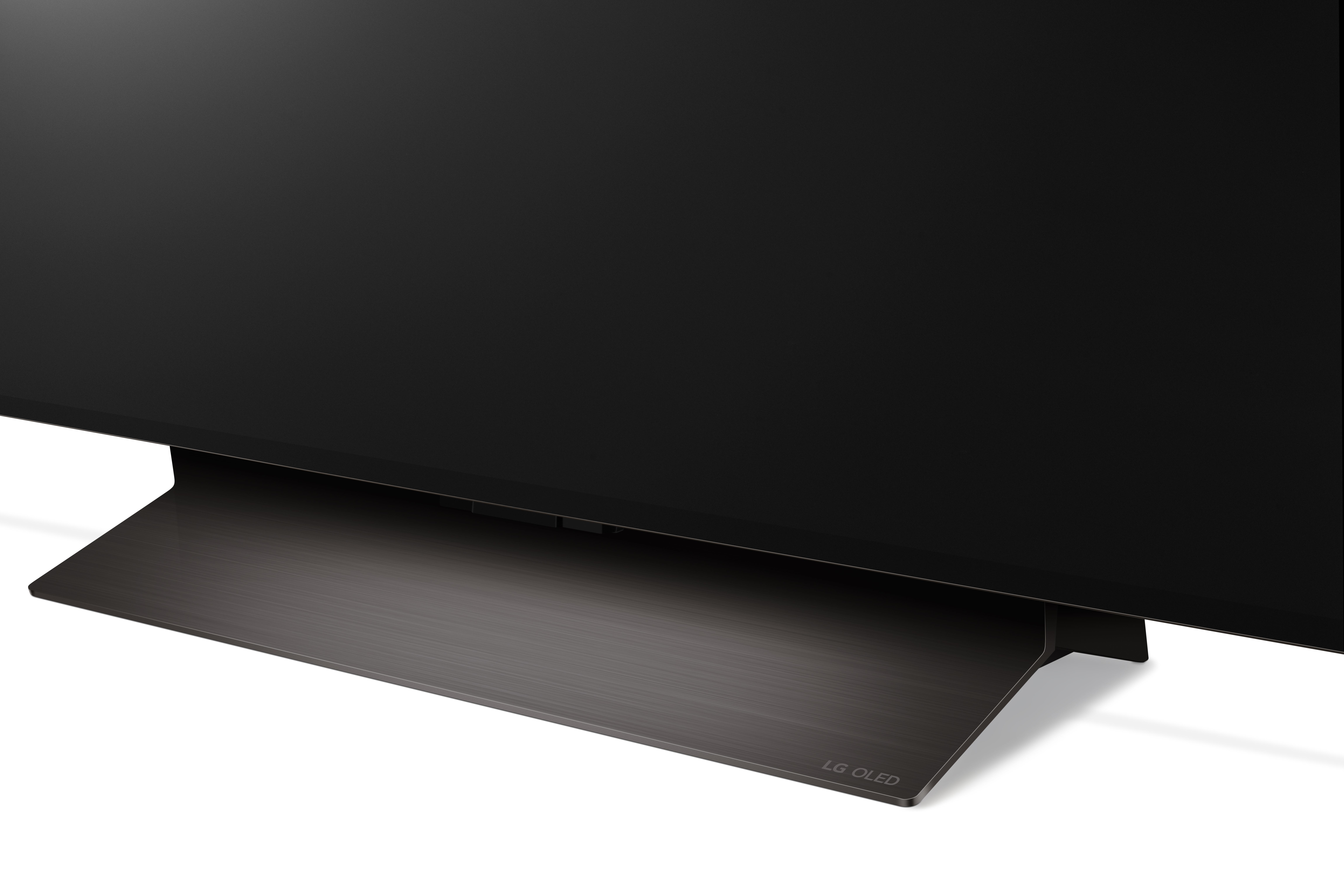 Nahaufnahme eines LG OLED TV-Sockels. Schwarze und metallisch-graue Farben.
