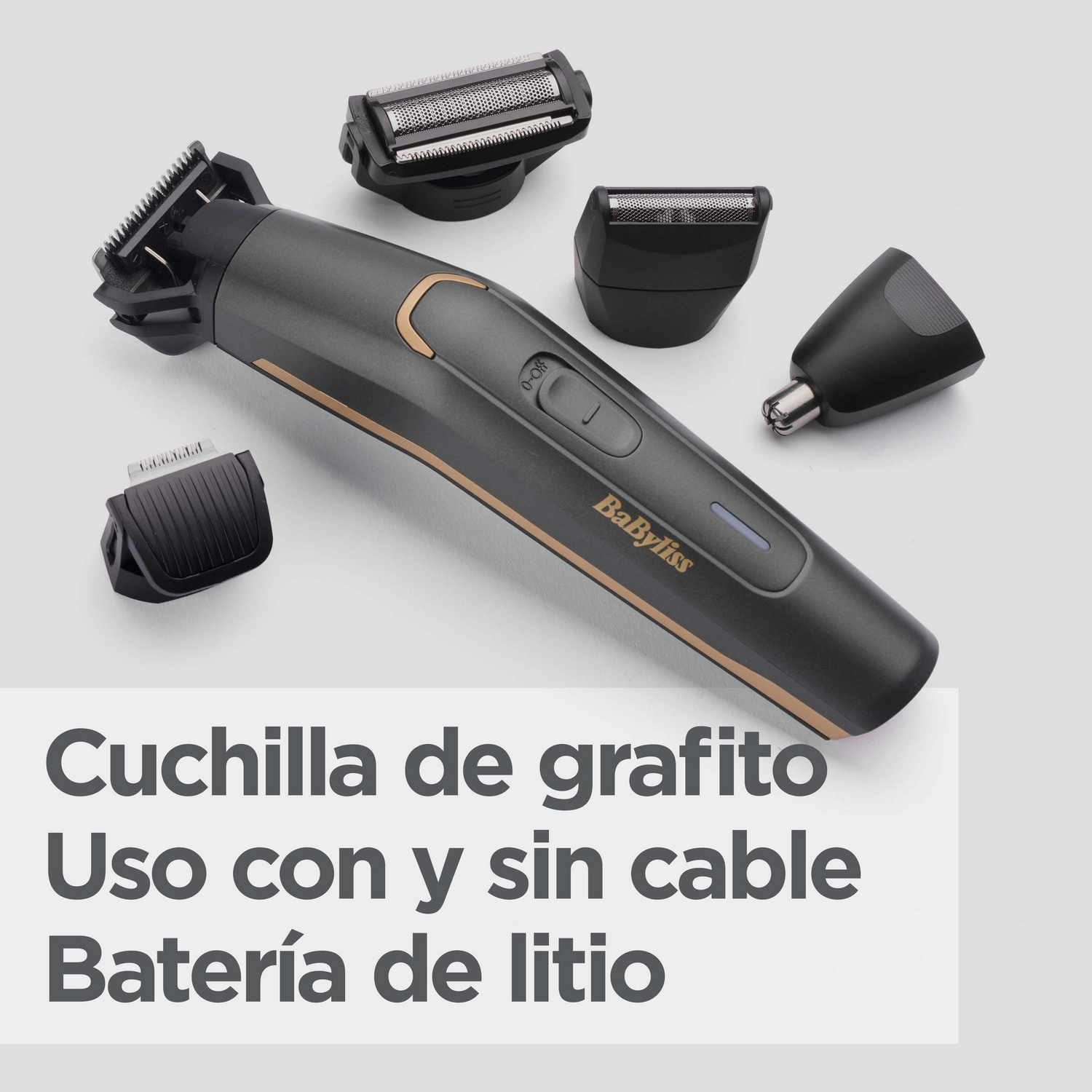 Afeitadora eléctrica Babyliss negra y dorada con varios accesorios, sobre una superficie gris clara.