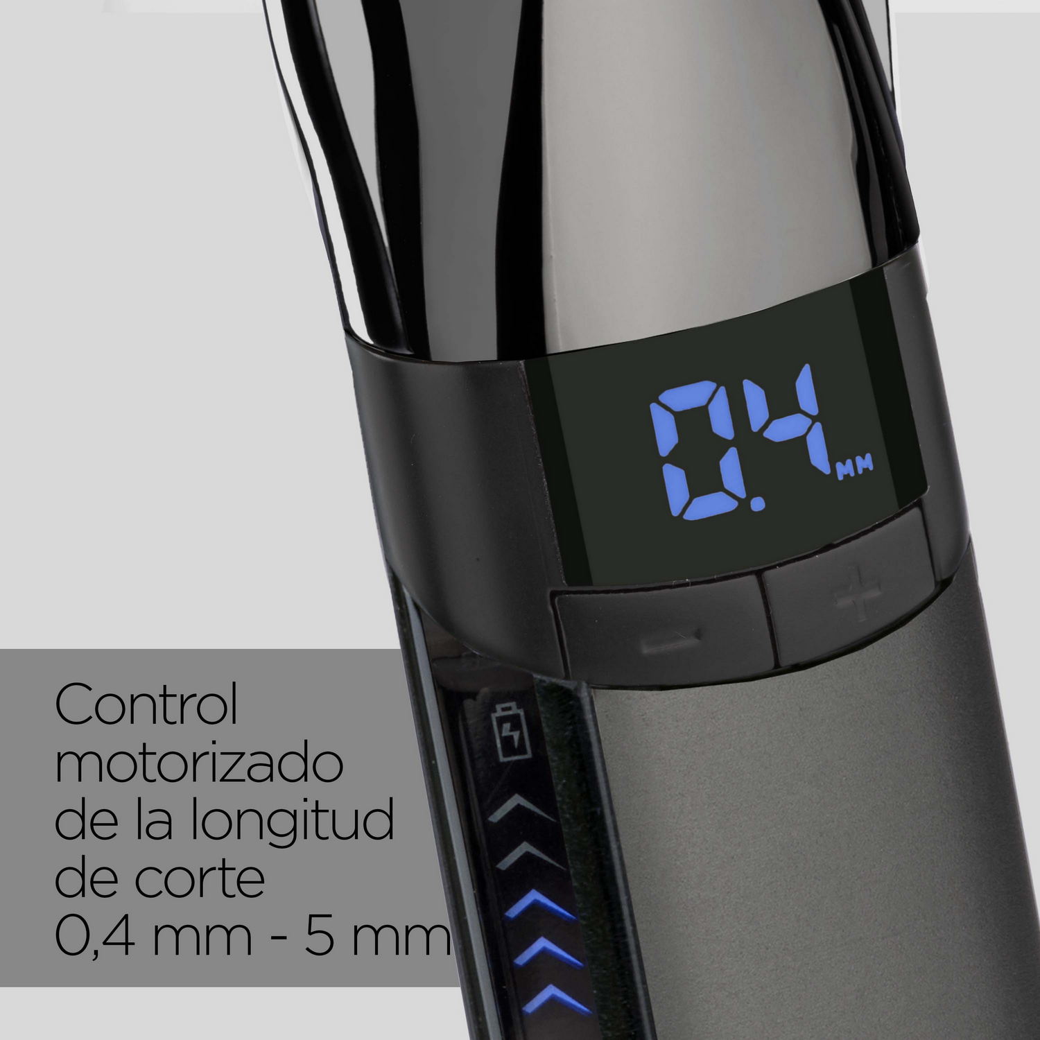 Primer plano de un cortapelos negro y gris que muestra una pantalla digital con el número 0,4 mm.