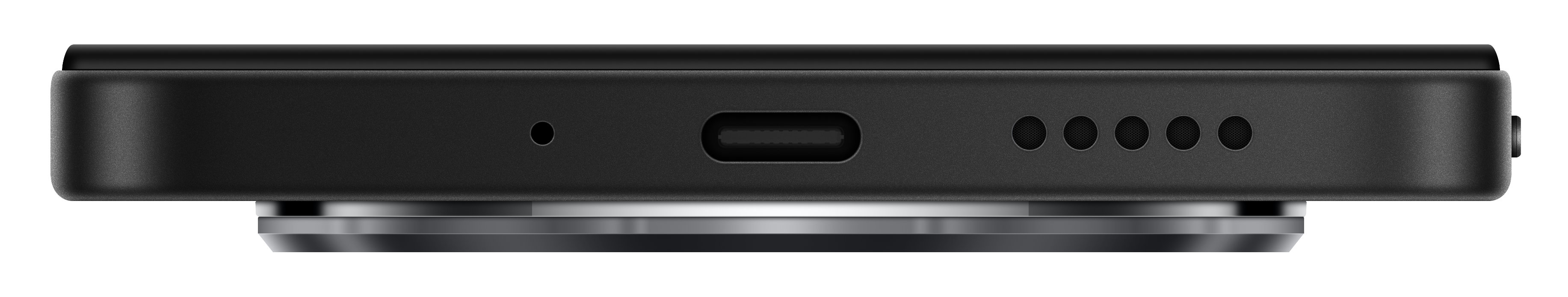 Zbliżenie dolnej części czarnego telefonu. Ma port ładowania i otwory głośnikowe.