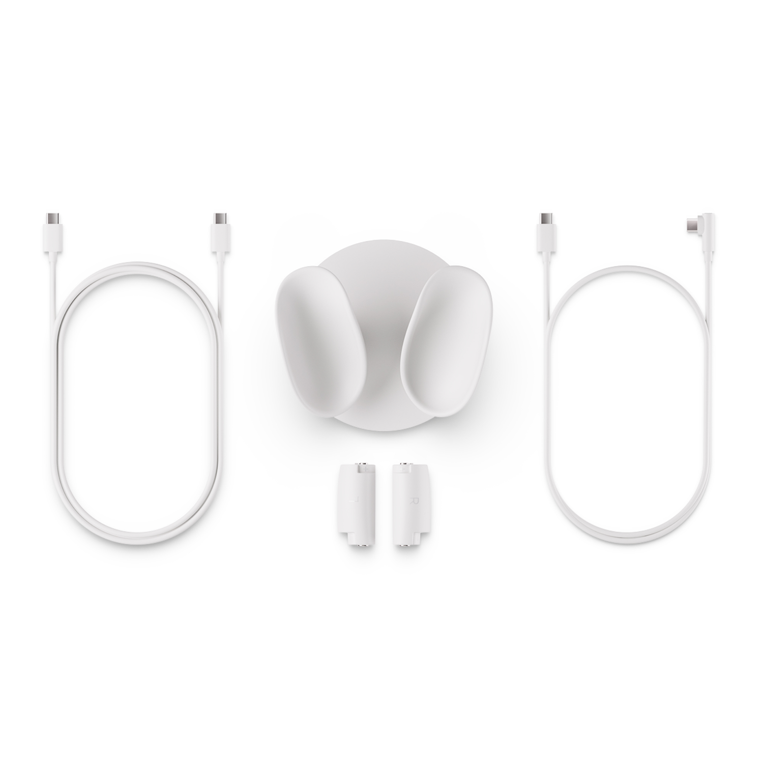 White charging dock with two charging ports and two small white charging adapters, and two white cables.