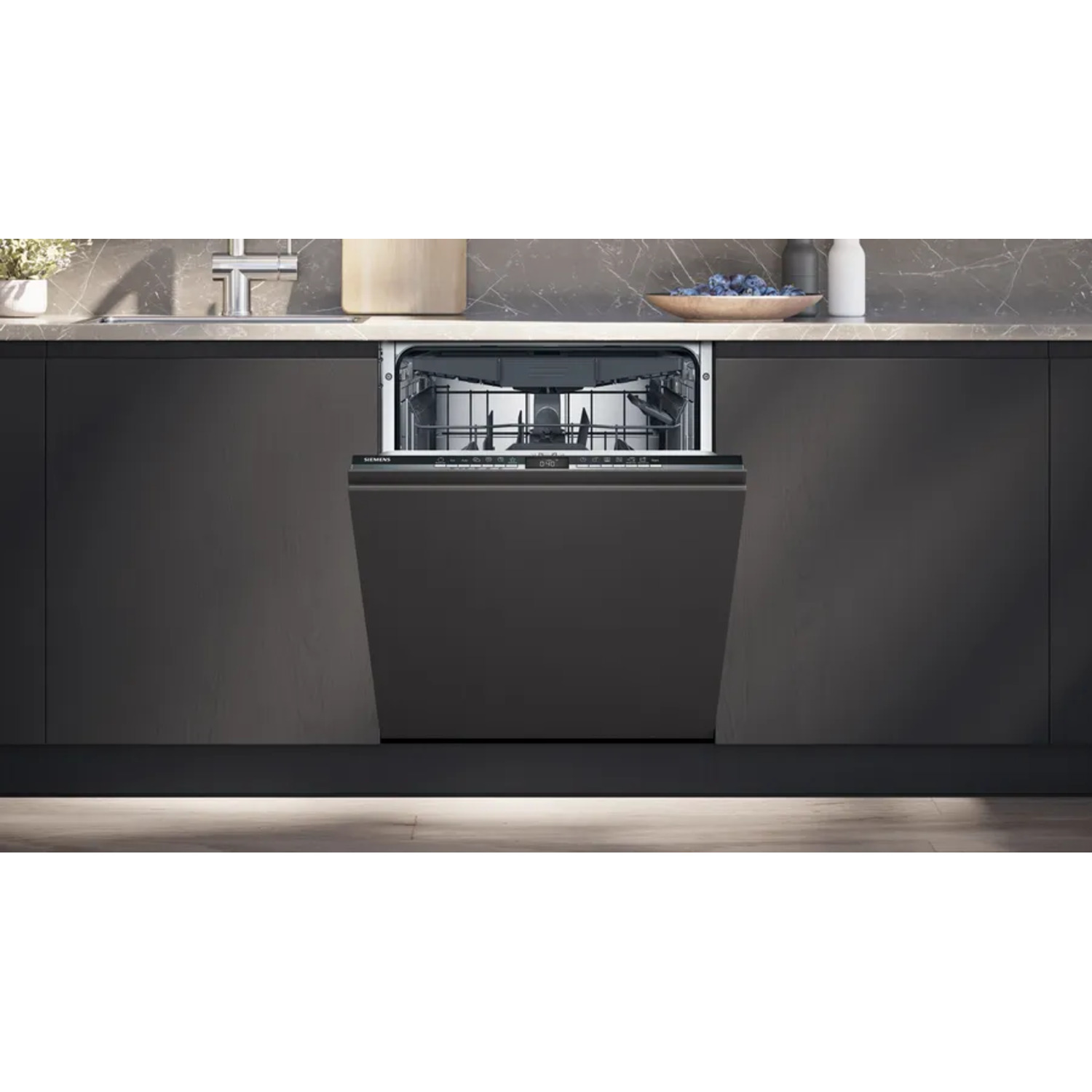 An open, integrated dishwasher within a modern kitchen.