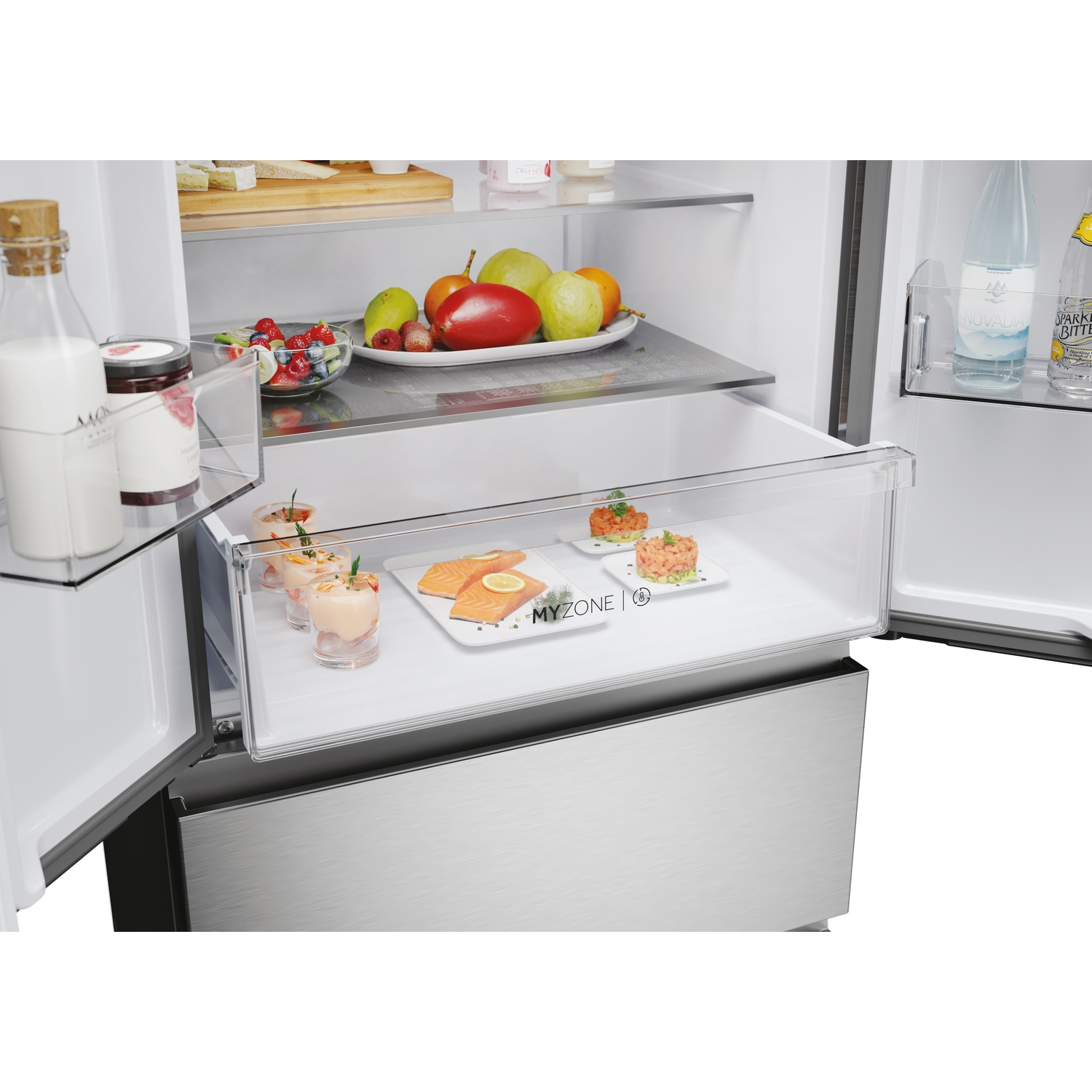 Open refrigerator with food: salmon, fruits, drinks in various compartments.