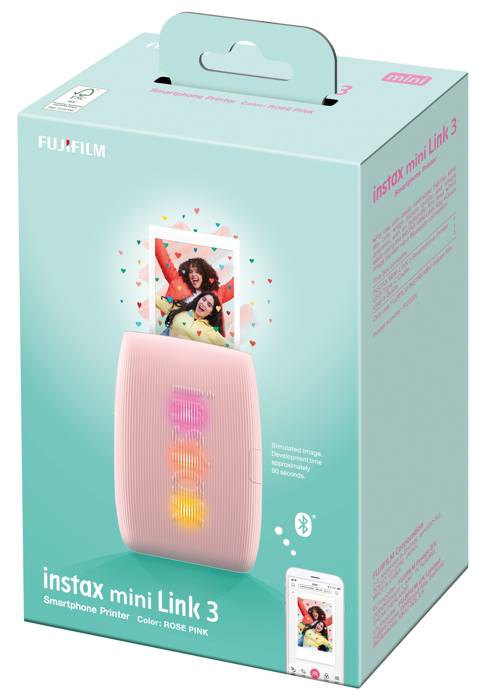 Różowa drukarka instax mini Link 3 w pudełku. Zdjęcia ludzi i ekran telefonu.