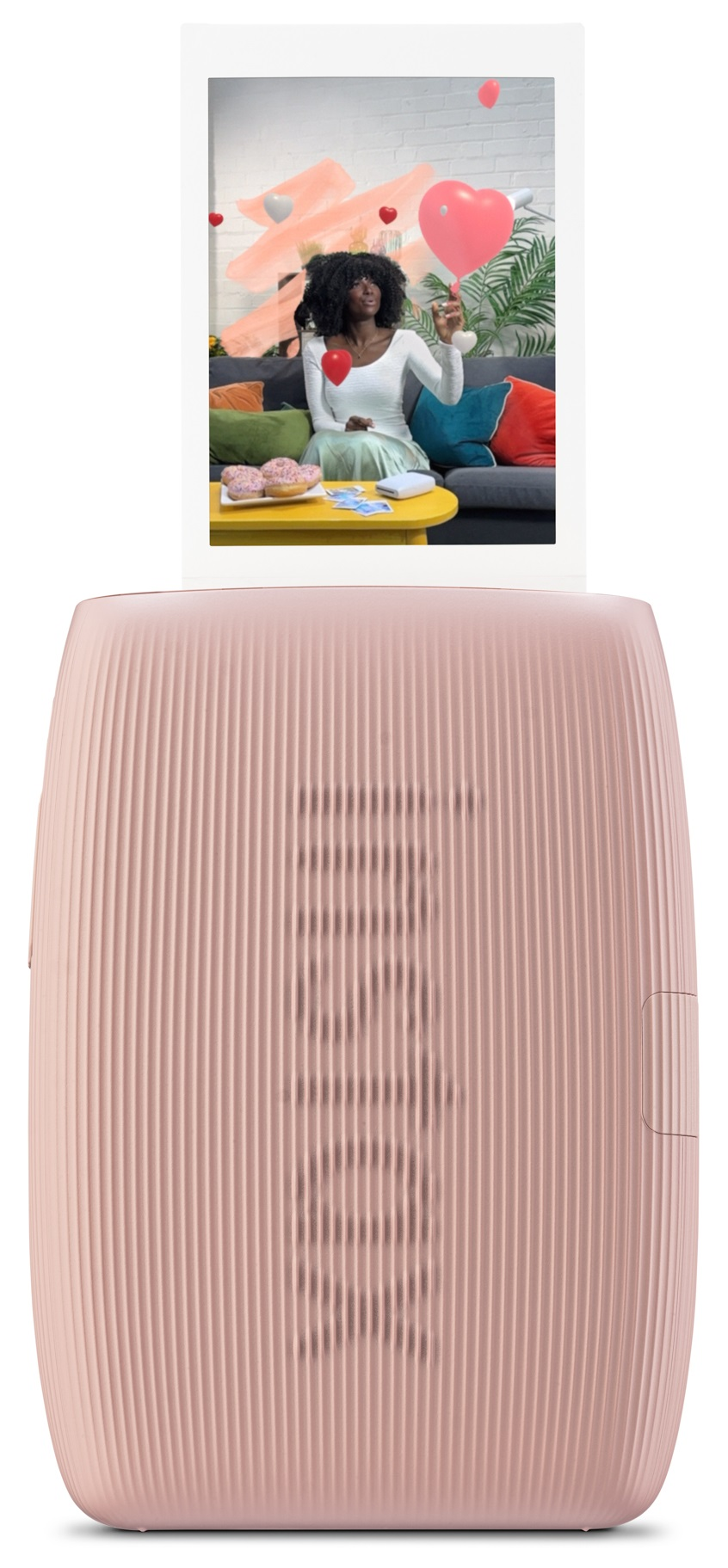 Różowa drukarka drukuje zdjęcie z telefonu komórkowego.