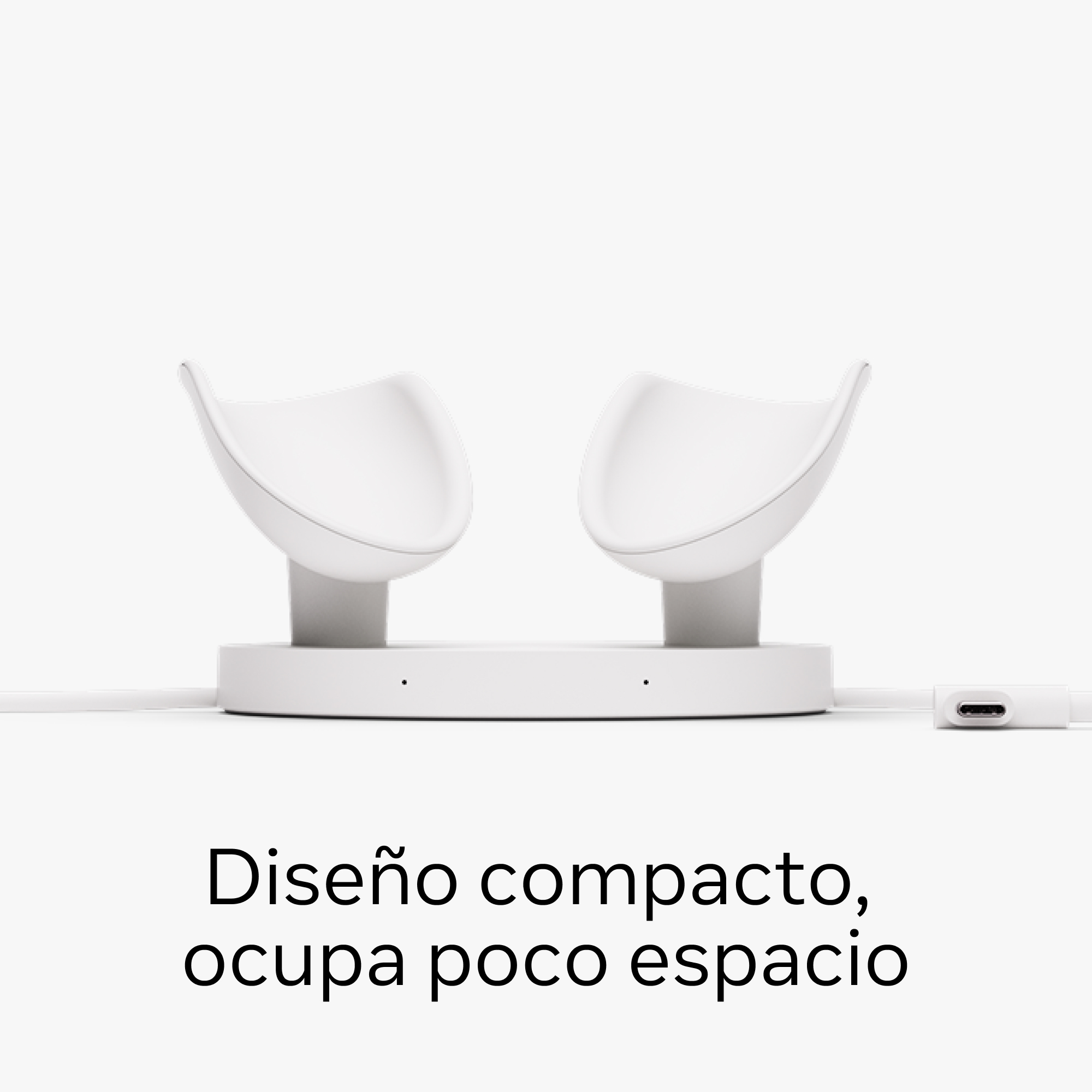 Base de carga blanca con dos soportes para auriculares. Texto: Diseño compacto, ocupa poco espacio.