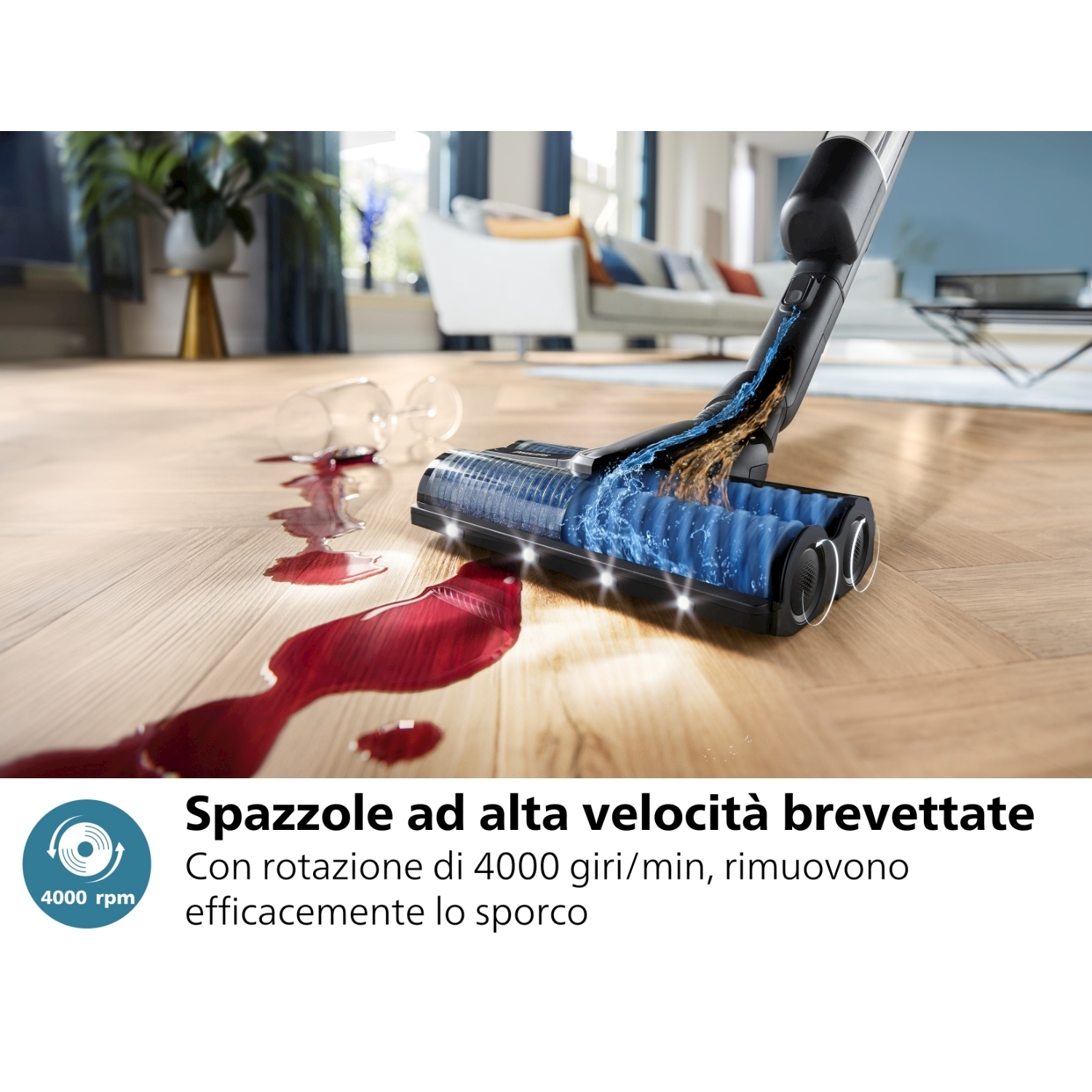 Aspirapolvere con flusso d'acqua che pulisce un liquido rosso su un pavimento in legno.
