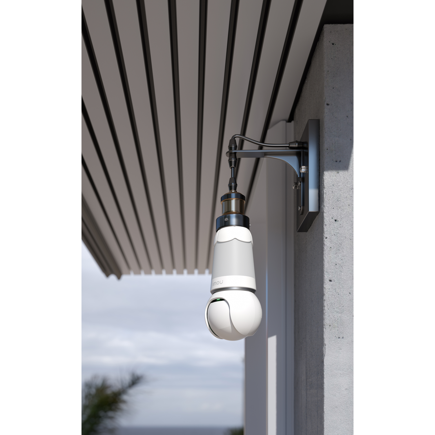 A white and grey security camera mounted on a wall under a roof.