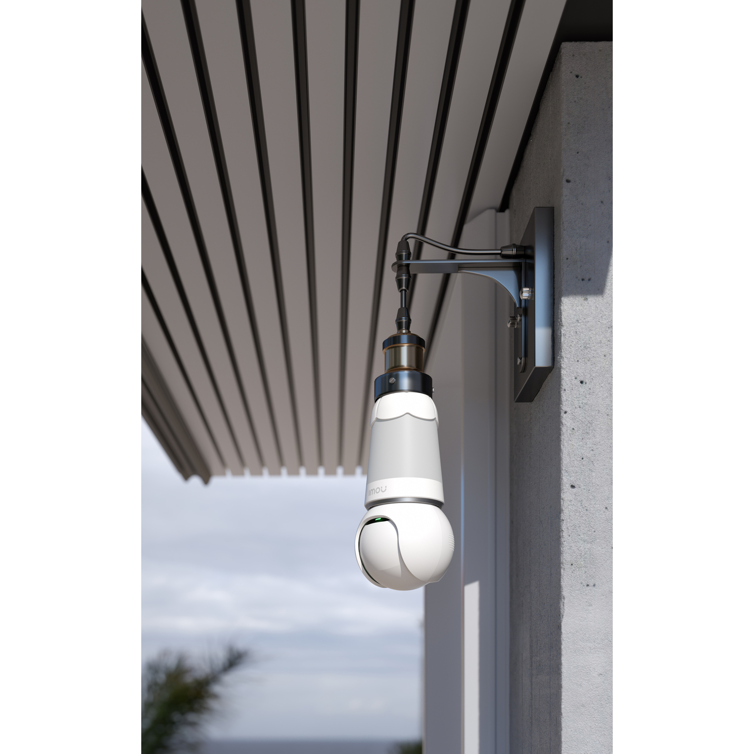 Outdoor security camera mounted on a wall, hanging from a bracket.